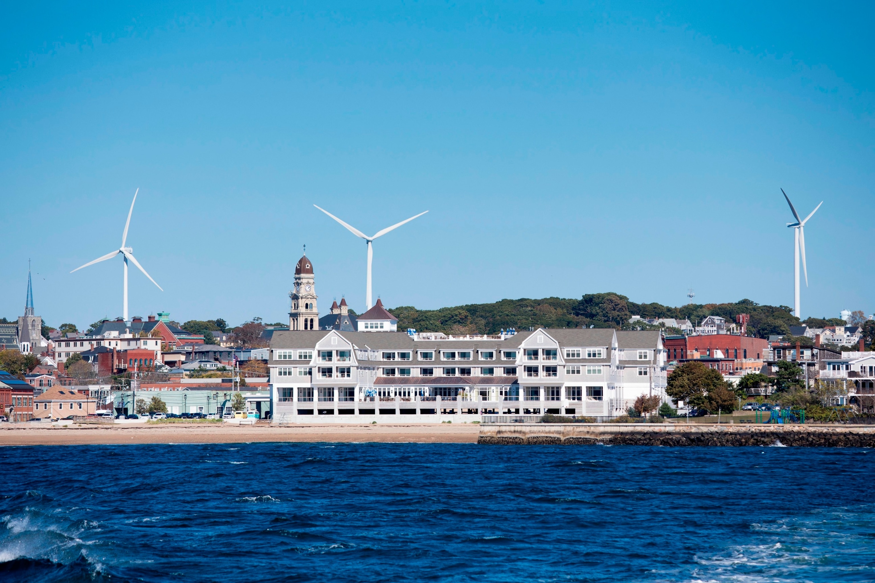 PHOTO: In this Oct. 19, 2018, file photo, the Beauport Hotel is shown with sweeping waterfront ocean views and wind turbines behind in Gloucester, Massachusetts.