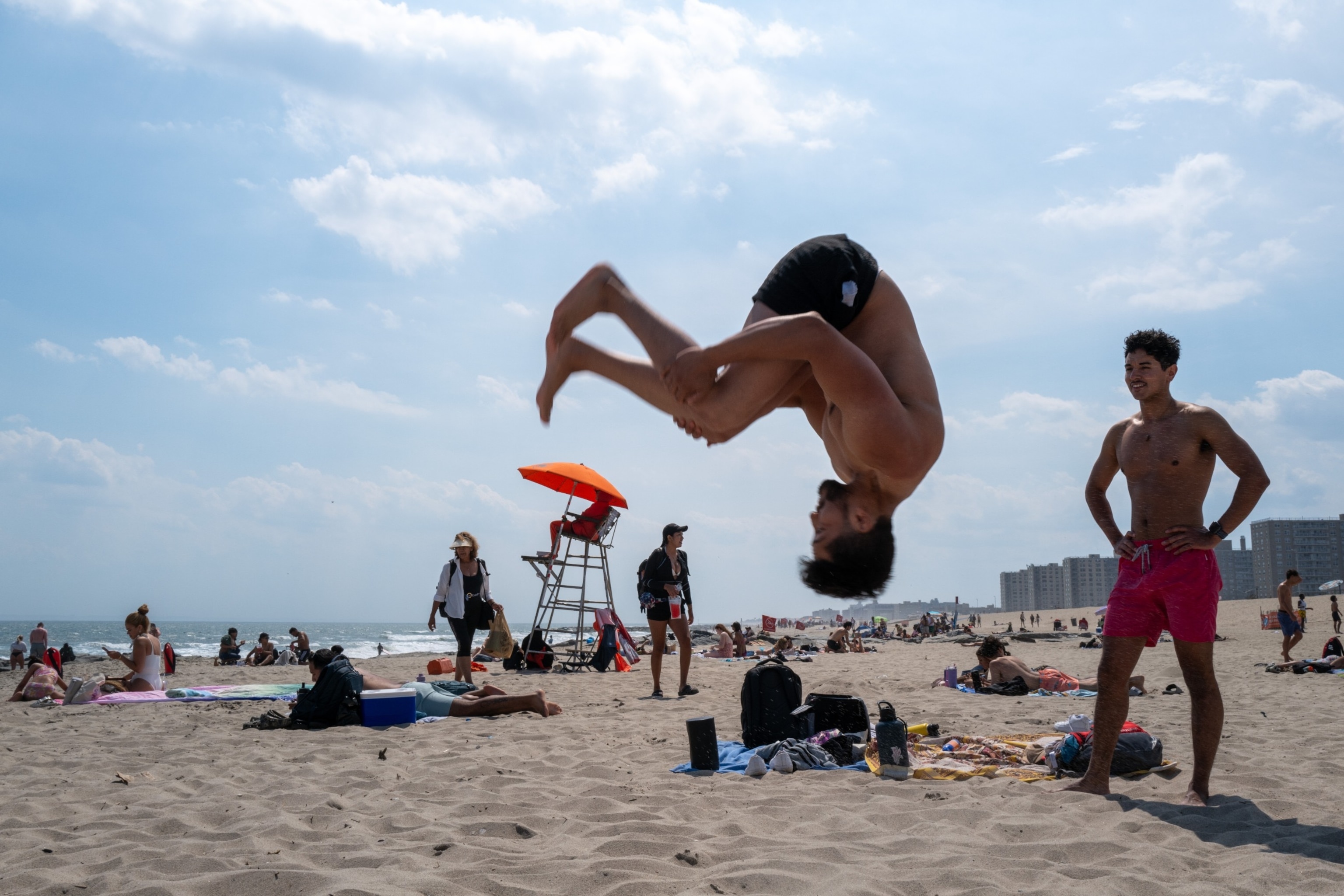 PHOTO: People spend the day at Rockaway Beach as high temperatures return in New York City, June 26, 2024.