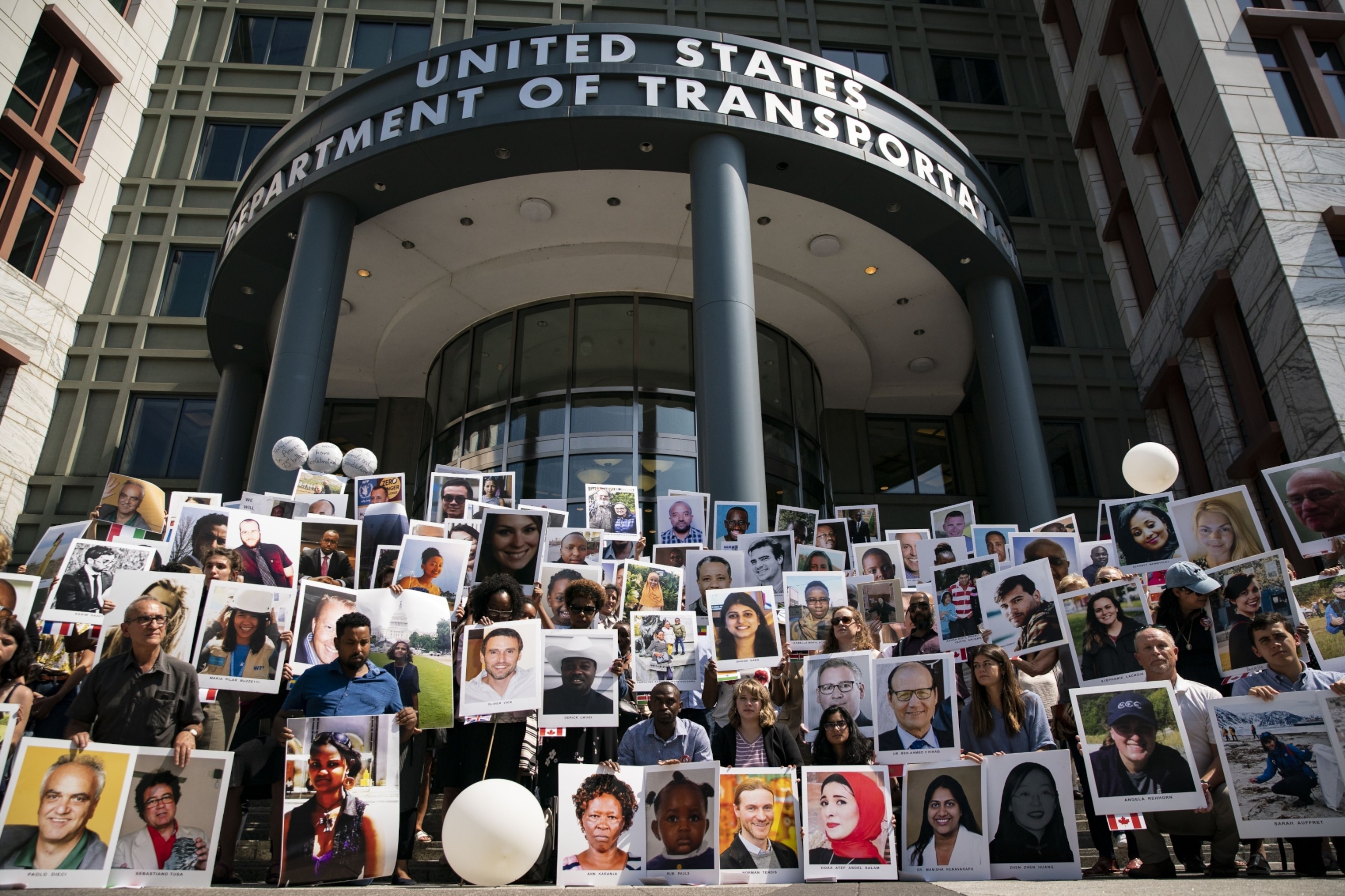 PHOTO: Family members of victims from the Ethiopian Airlines Flight 302 crash hold photographs during a vigil outside the Department of Transportation in Washington, D.C., Sept., 10, 2019. 