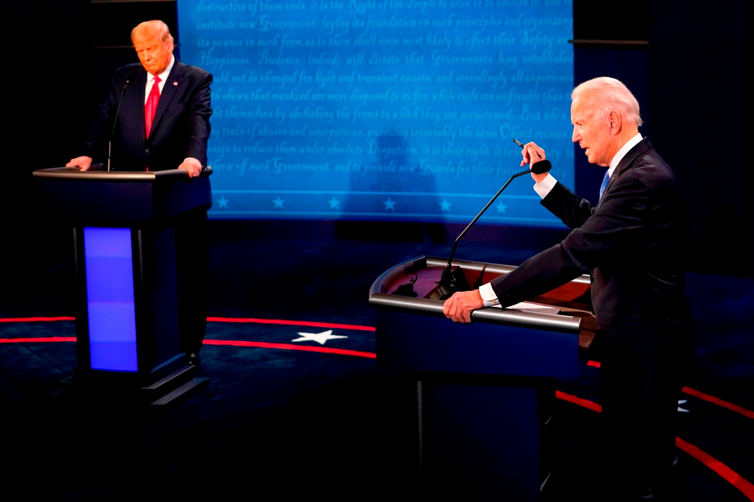 PHOTO: Joe Biden speaks, as President Donald Trump, left, listens during the U.S. presidential debate at Belmont University in Nashville, Tennessee, Oct. 22, 2020.