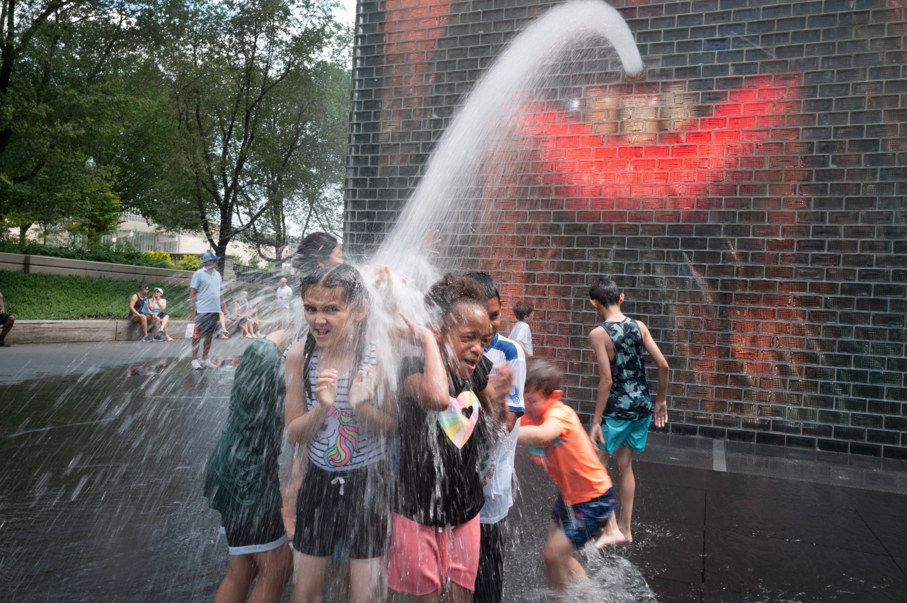 PHOTO: People cool off at Crown Fountain in Millennium Park as temperatures reached a record high of 97 degrees Fahrenheit on June 17, 2024 in Chicago, Illinois.