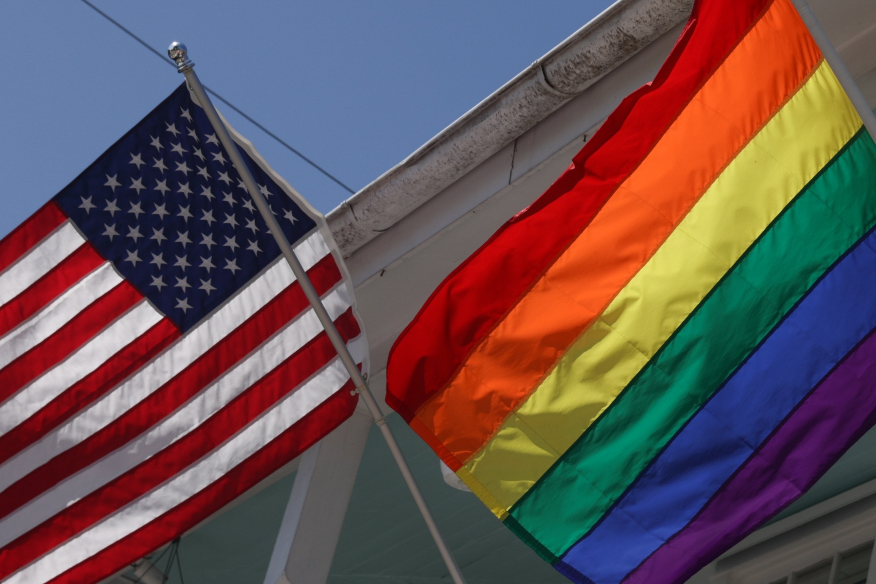 PHOTO: American and LGBT flags are seen in Key West, Fla., on May 7, 2024. 