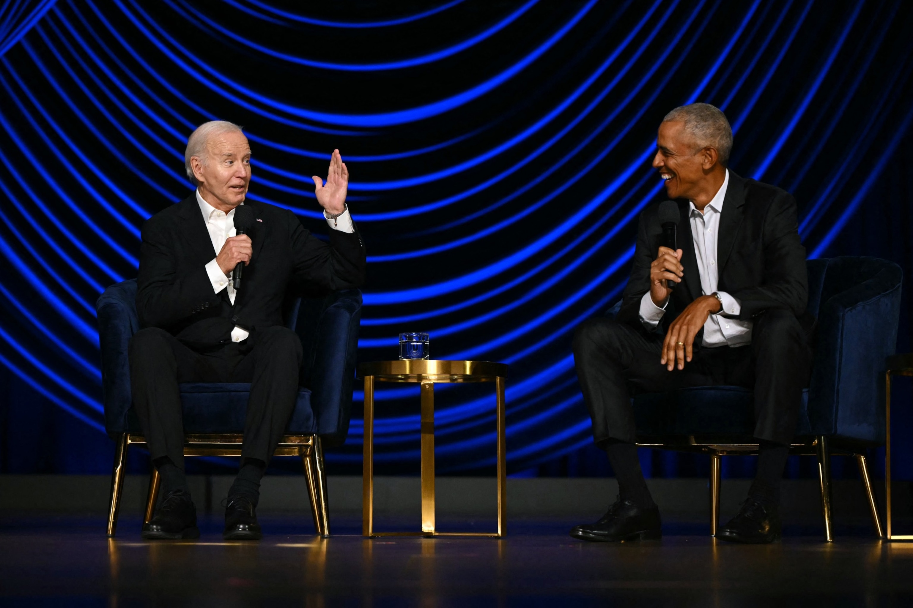 PHOTO: President Joe Biden speaks flanked by former President Barack Obama onstage during a campaign fundraiser at the Peacock Theater in Los Angeles on June 15, 2024.