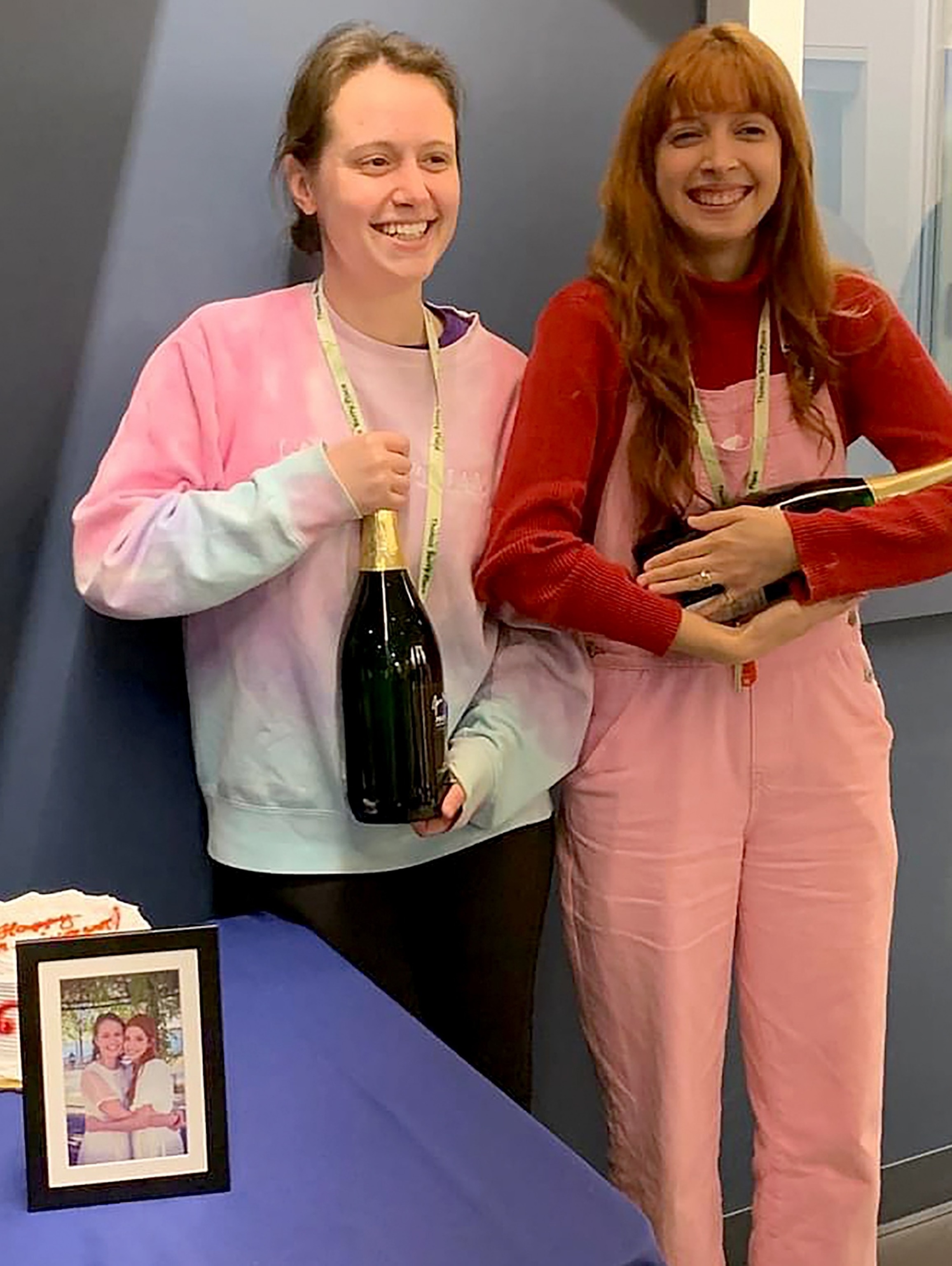 PHOTO: McKenna Coyle, left, and Larissa Santiago Coyle, right, celebrate their one-year wedding anniversary at the Catholic Lesbians retreat. The group surprised the couple with music, cake, and a blessing. 