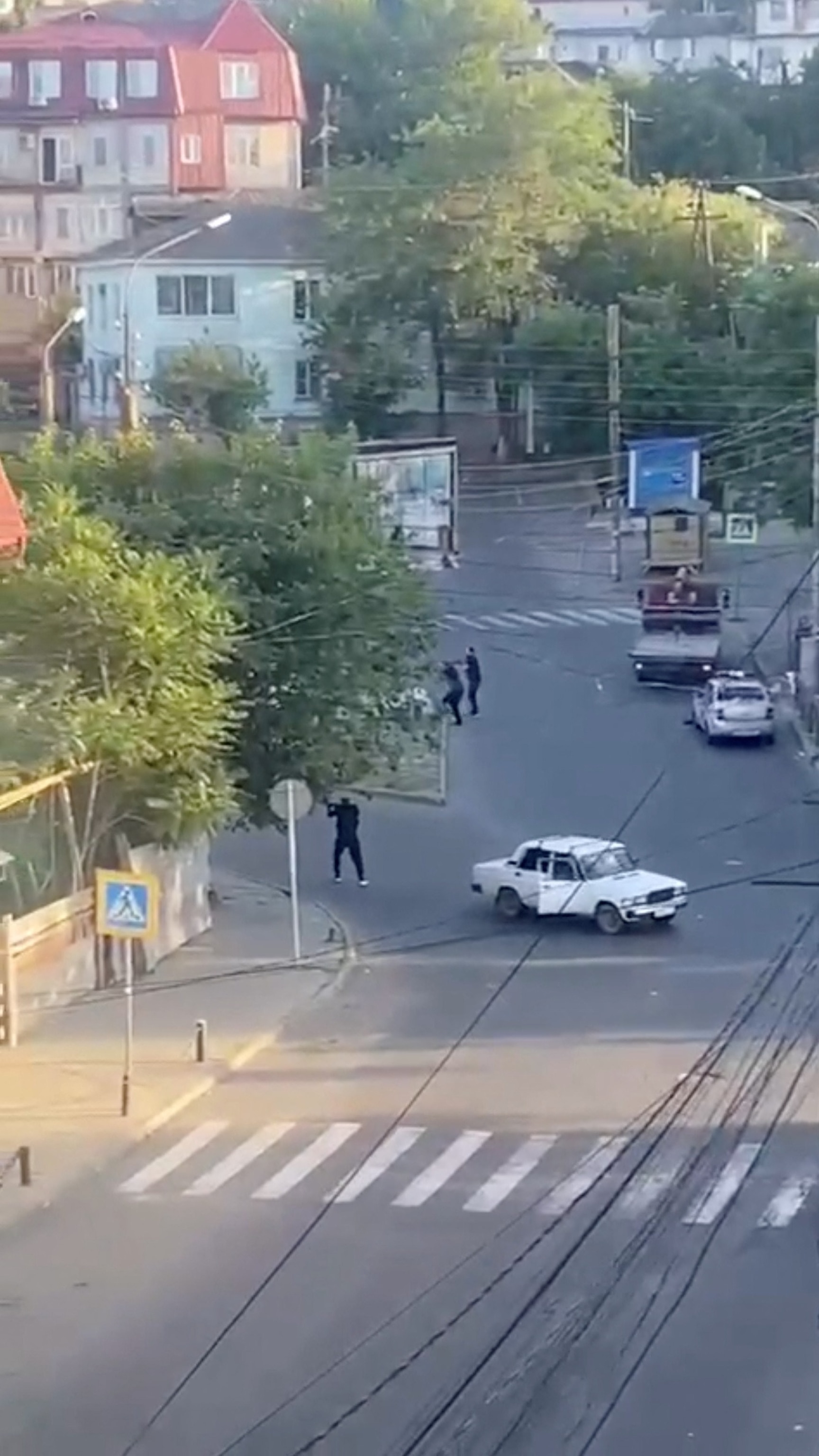 PHOTO: A view shows a shooting scene on the street of Makhachkala in southern Russia, June 23, 2024, in this still image obtained from a video. 