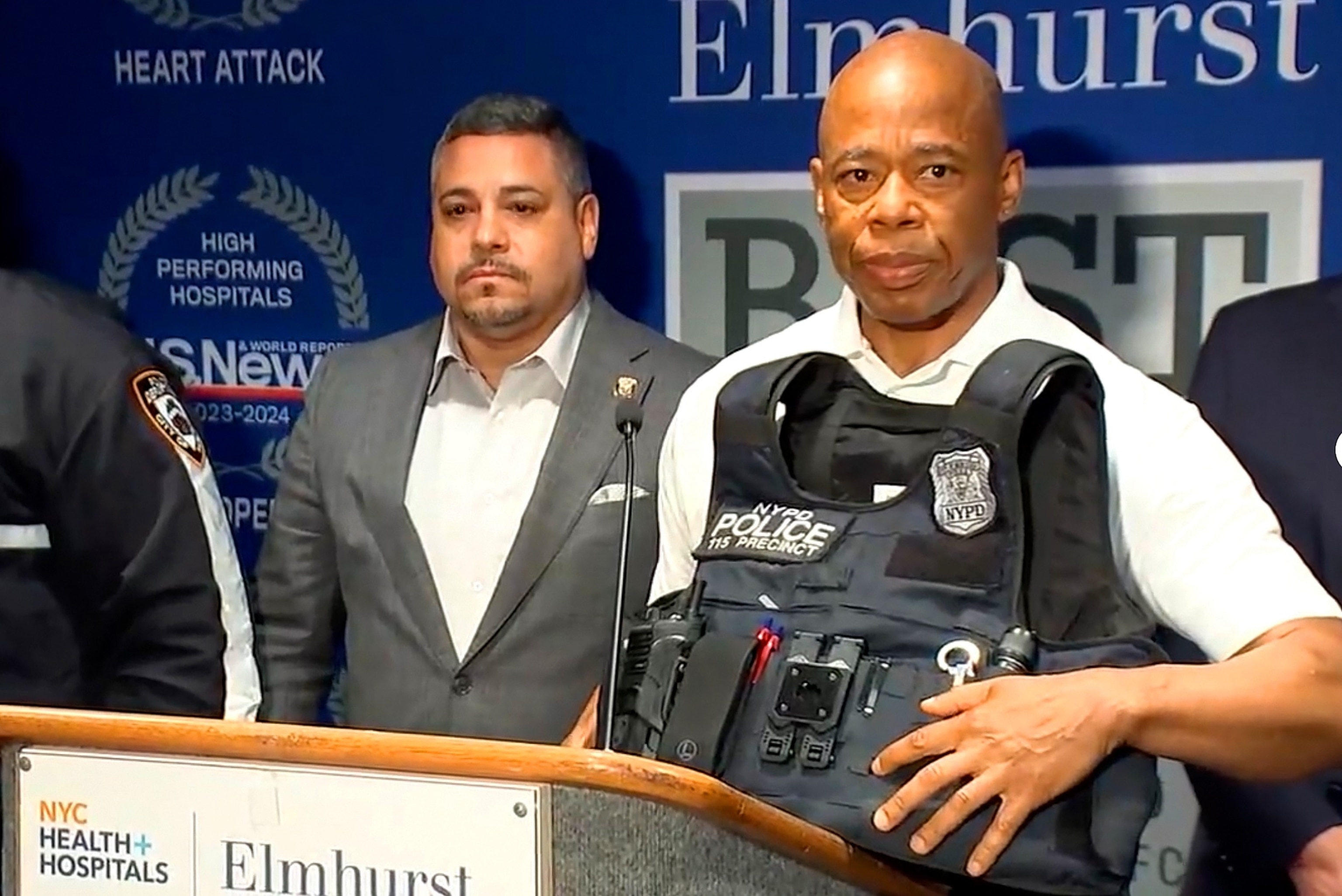 PHOTO: New York City Mayor Eric Adams points to a bullet hole in the bulletproof vest an NYPD officer was wearing when he was shot on June 3, 2024, in a shootout with a robbery suspect.