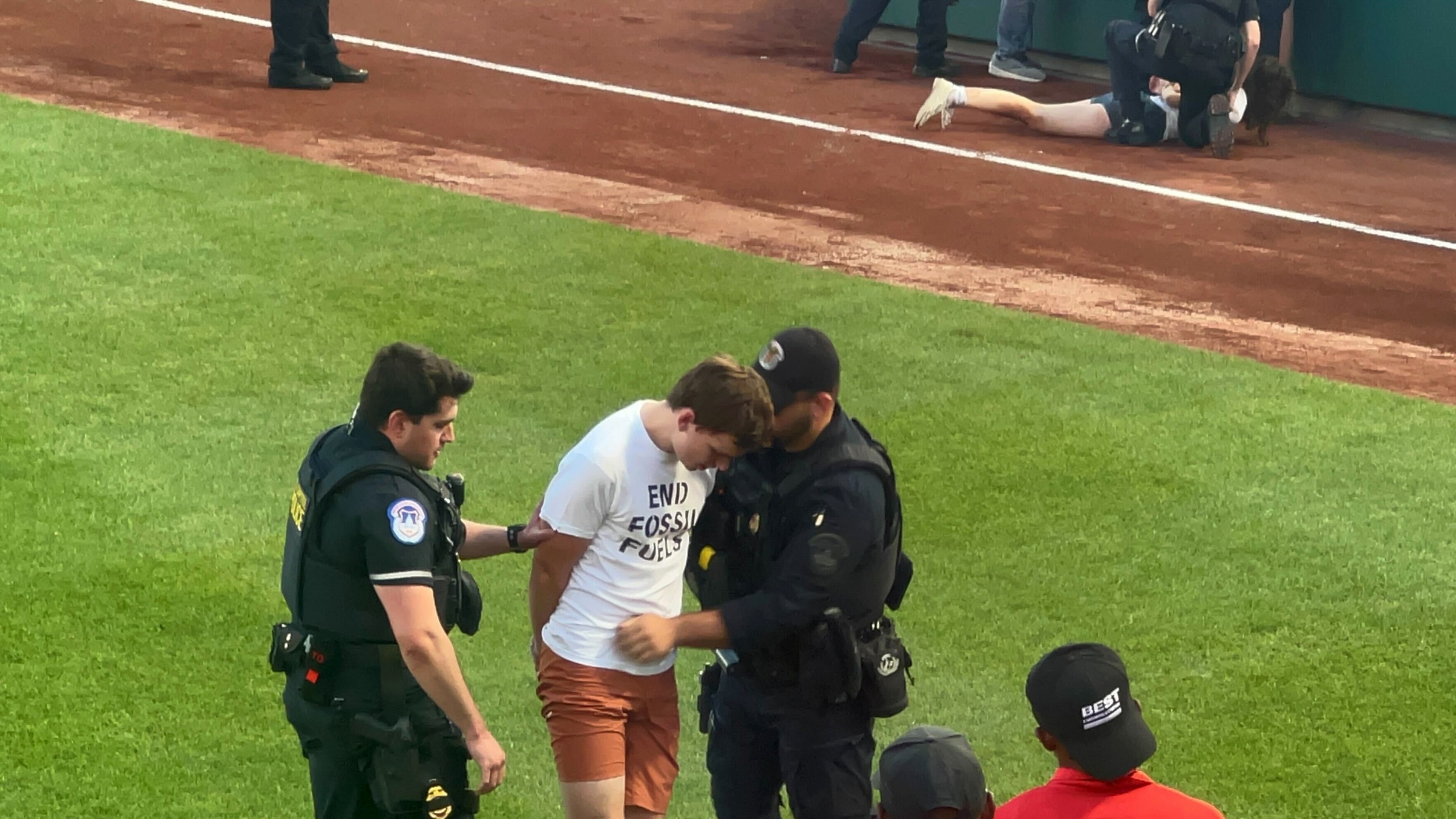 PHOTO: Anti-fossil fuel protesters invade the field at the Congressional baseball game in Washington, D.C., on June 12, 2024.