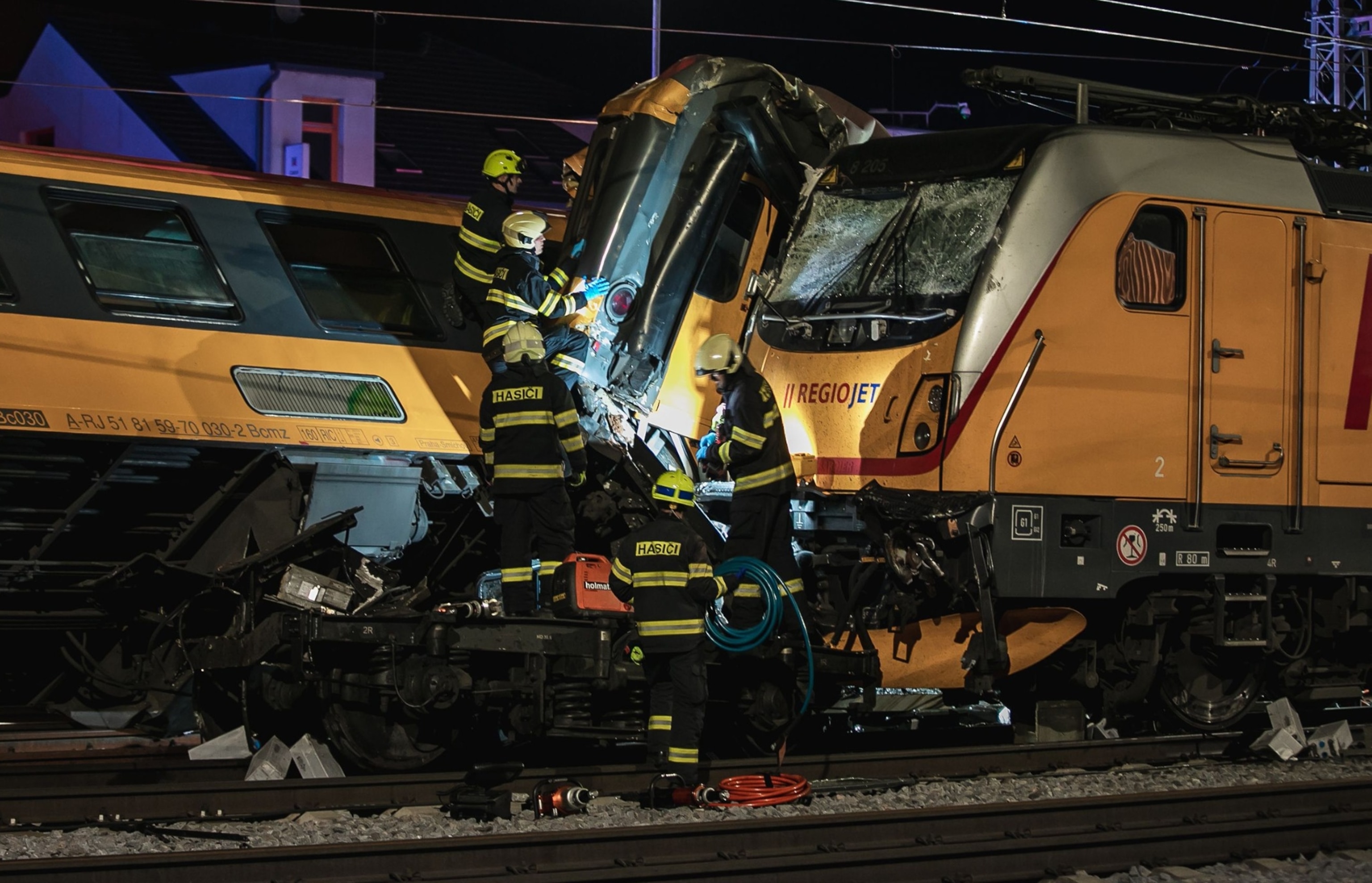 PHOTO: Firefighters work in the aftermath of a train crash in the city of Pardubice, Czech Republic, on June 5, 2024. 