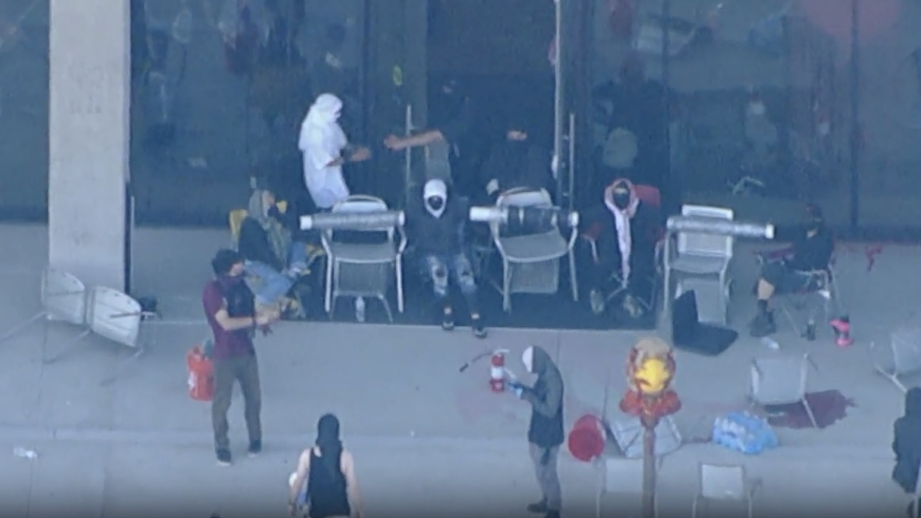 PHOTO: Protesters block the door of the Student Services Building at California State University Los Angeles on Thursday, June 13, 2024, in this screengrab from an aerial video. 