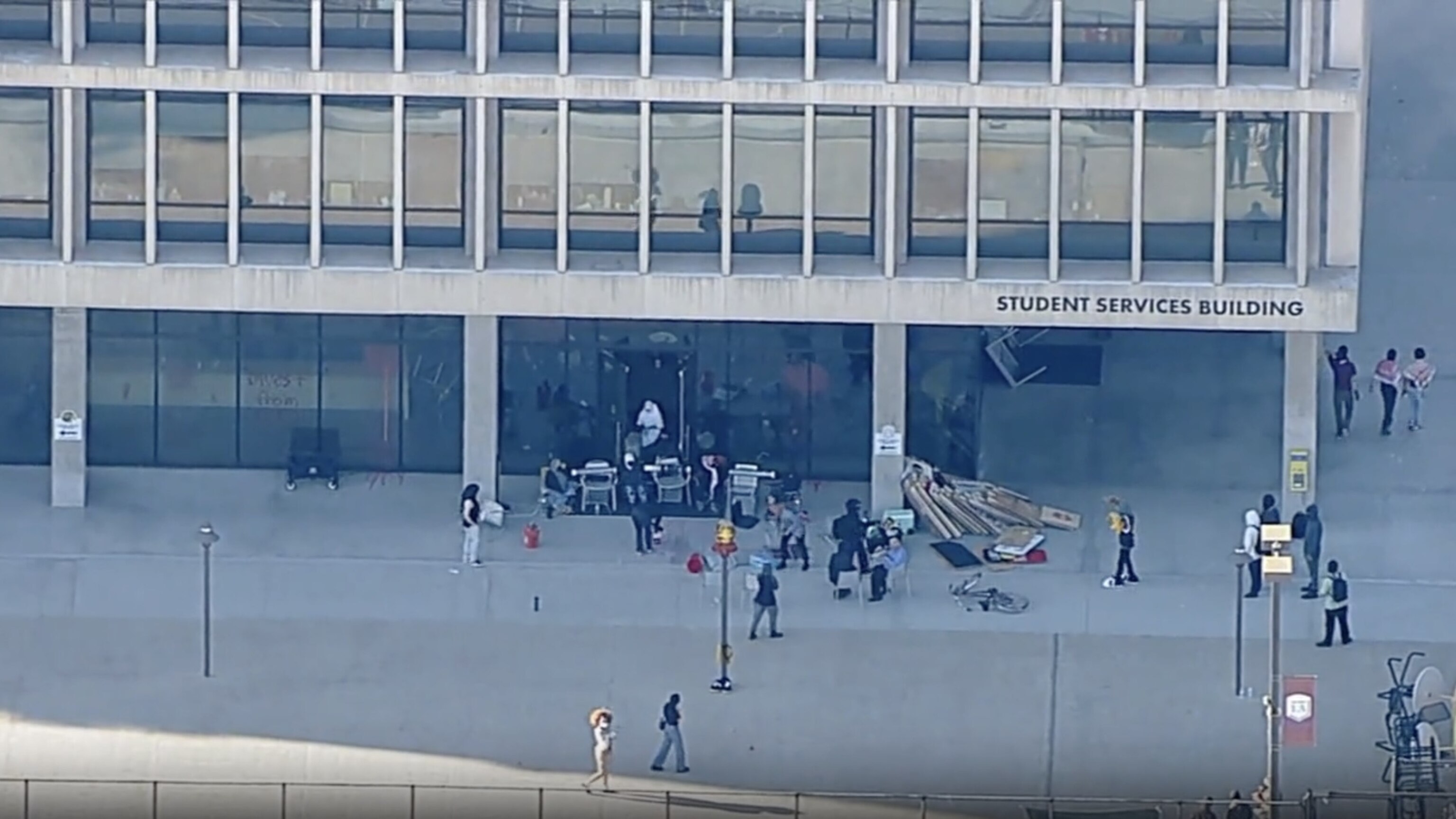 PHOTO: Protesters block the door of the Student Services Building at California State University Los Angeles on Thursday, June 13, 2024, in this screengrab from an aerial video. 