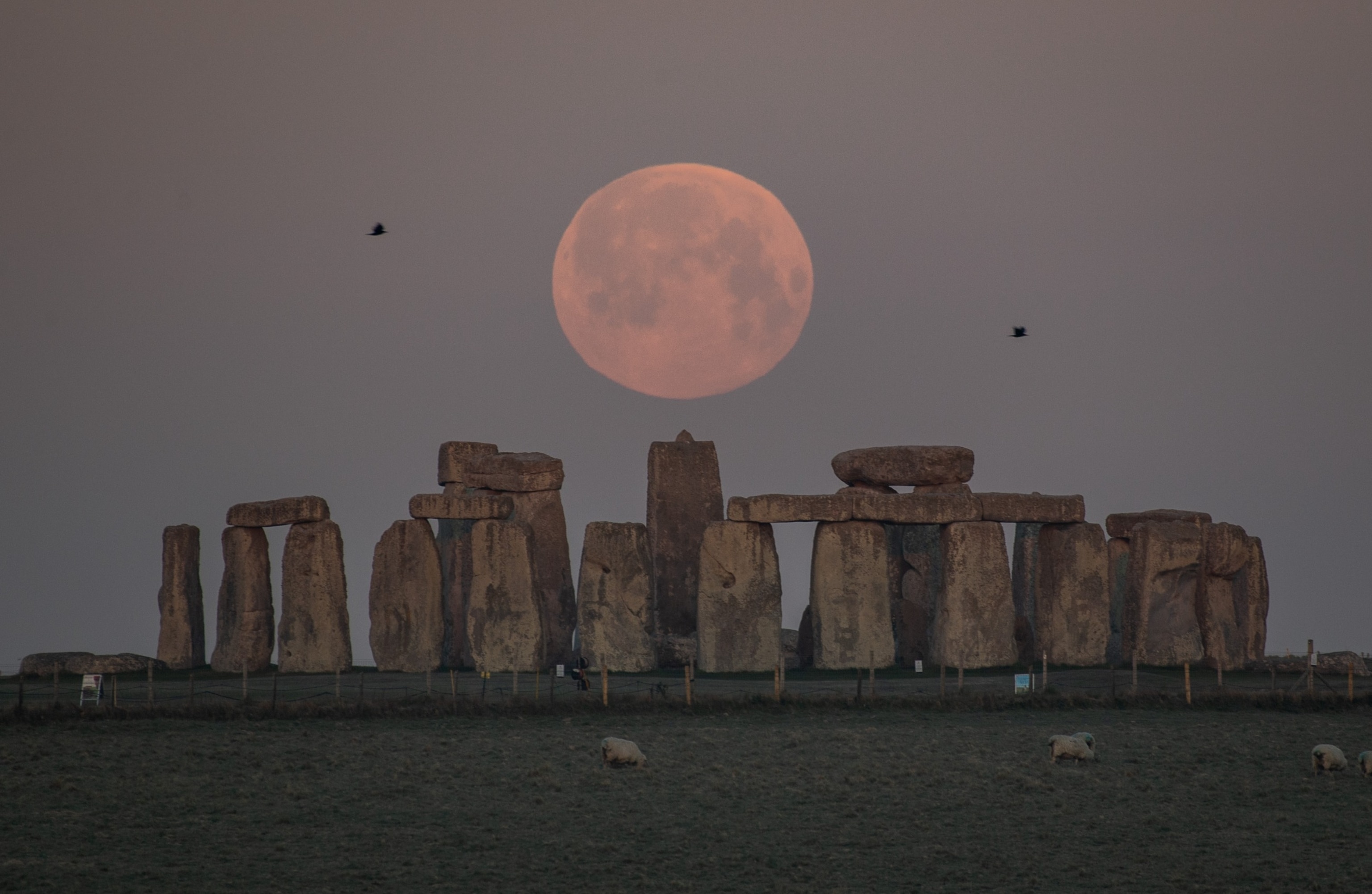 PHOTO: The full moon sets behind Stonehenge on April 27, 2021 in Amesbury, England. 