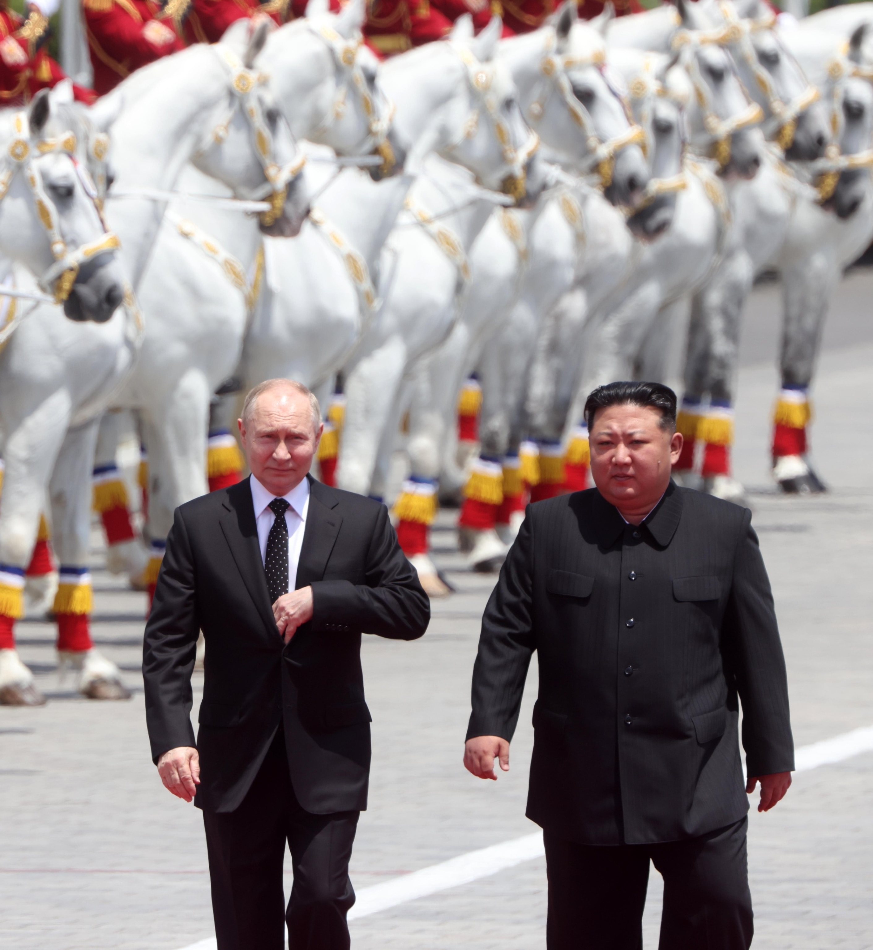  Russian President Vladimir Putin and North Korean Supreme Leader Kim Jong Un attend a welcoming ceremony on June 19, 2024, in Pyongyang, North Korea. (Photo by Contributor/Getty Images)