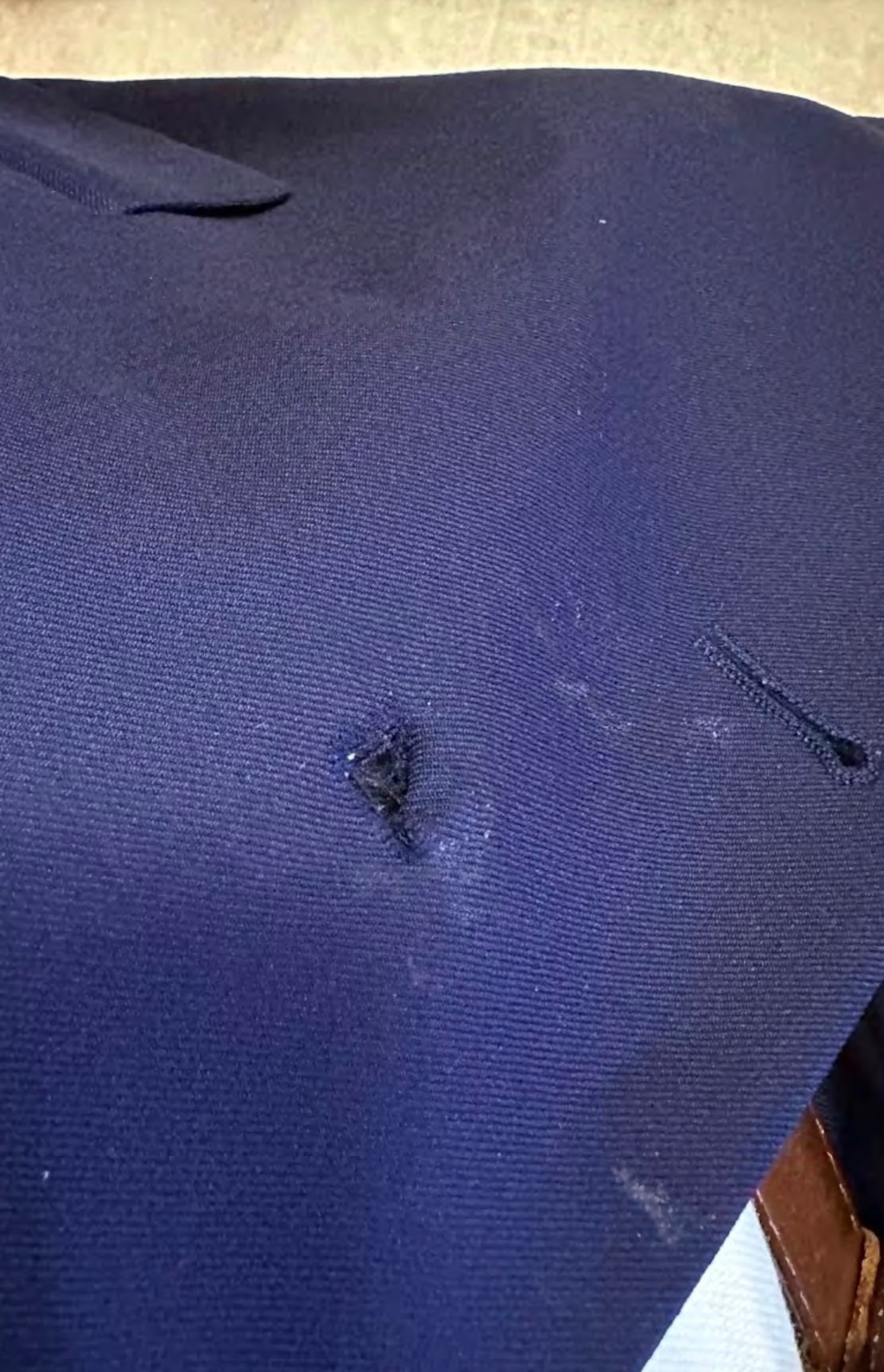 PHOTO: In a photo from a FOIA document acquired by Judicial Watch, an unnamed U.S. Secret Service agent's coat is shown with bite marks on it from a Commander Biden biting incident on Sept. 12, 2023.