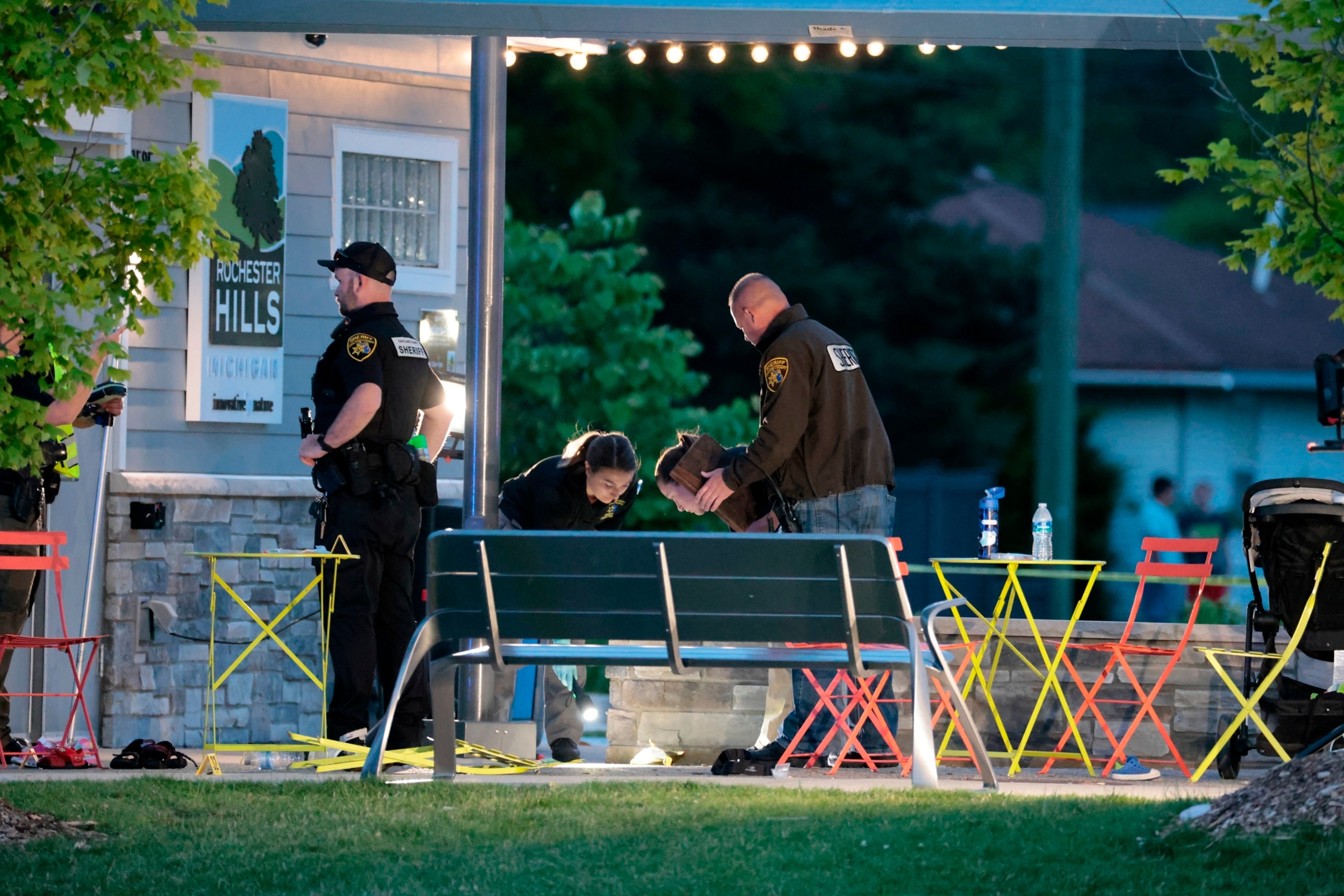 PHOTO: Oakland County Sheriff Evidence Technicians document the scene where a shooting took place at Brooklands Plaza Splash Pad in Rochester Hills, Michigan, June 15, 2024.