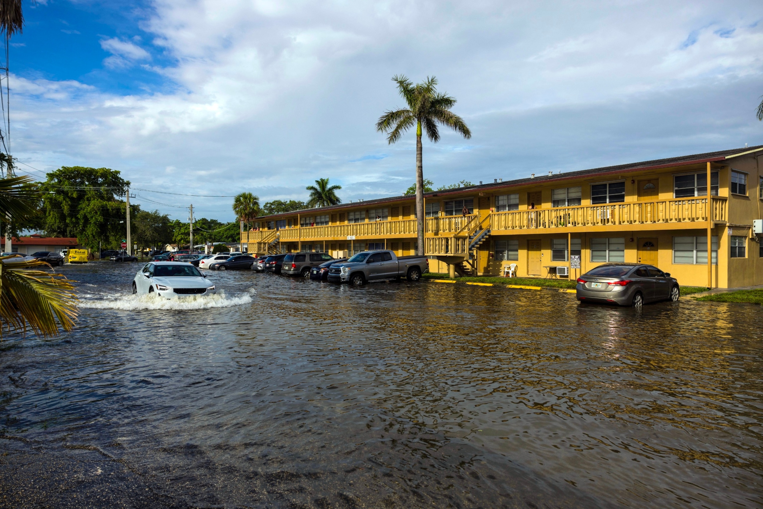 PHOTO: A car is driven along a flooded street in Hallandale Beach, Fla., on Thursday morning, June 13, 2024. 