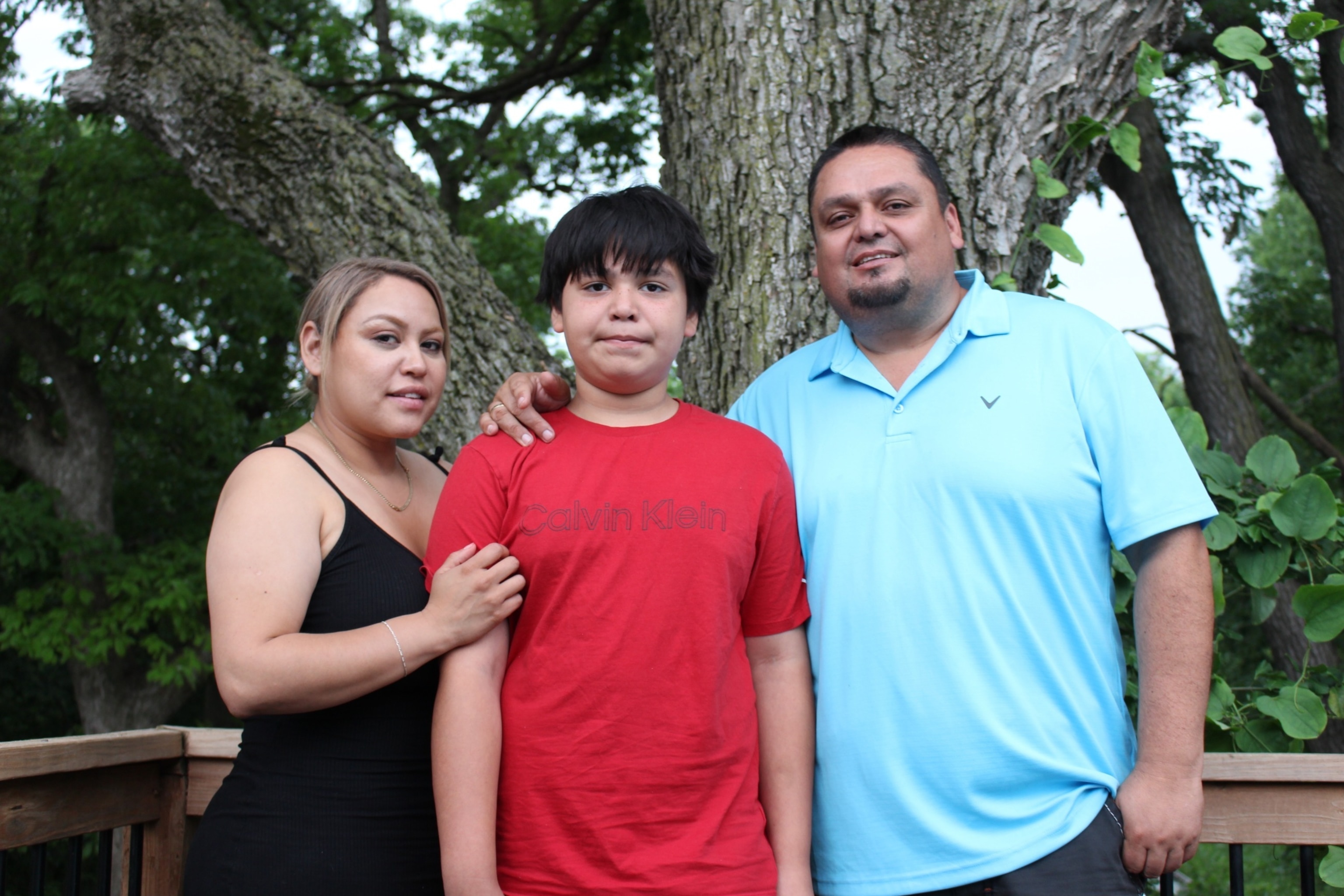 PHOTO: Samuel Arellano stands with his parents, Abigail and Antonio, outside their home in Kansas City, Kansas. 