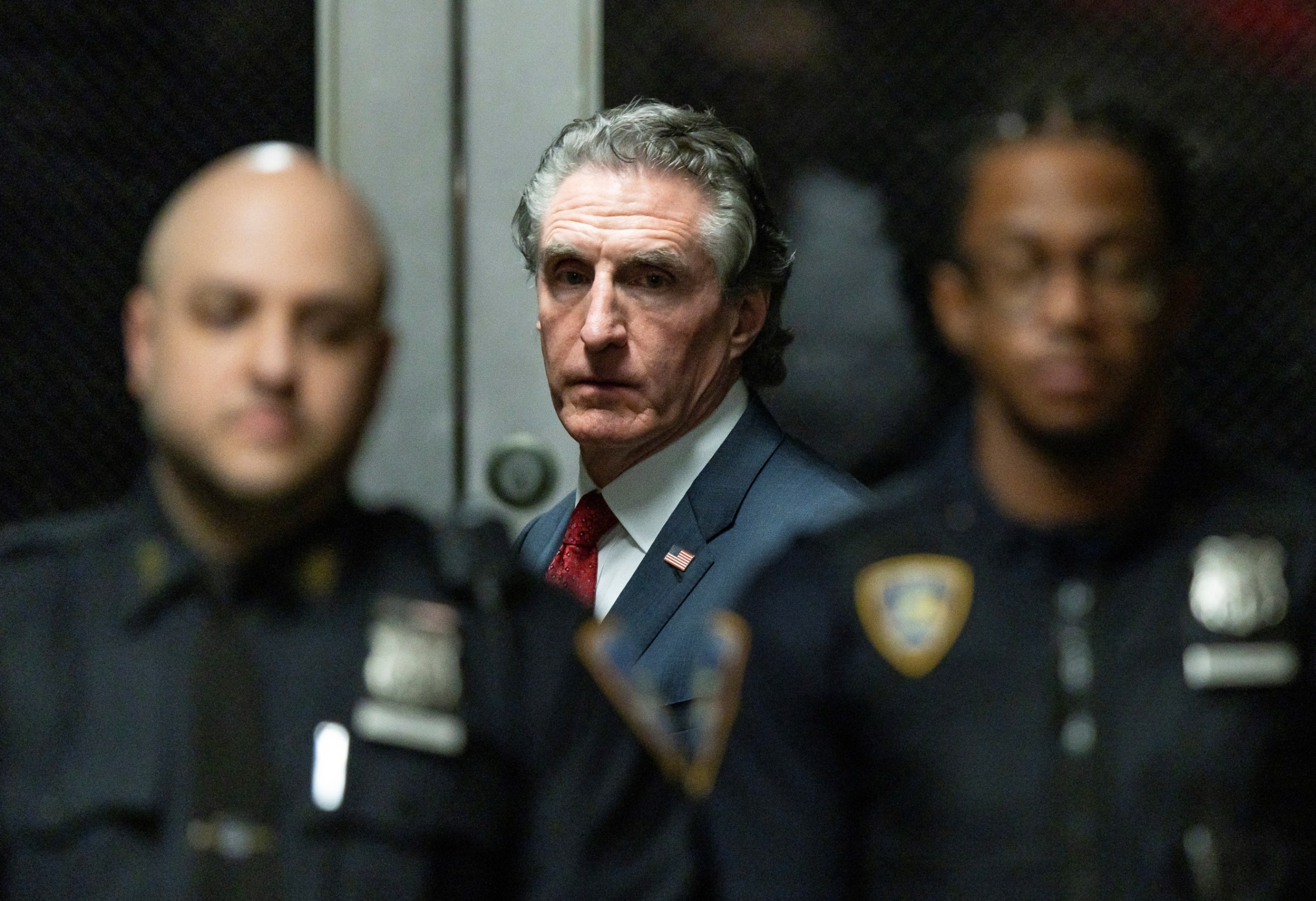 PHOTO: Gov. Doug Burgum, R-N.D., listens as former President Donald Trump speaks to members of the media at New York State Supreme Court, amid Trump's criminal trial, May 14, 2024, in New York.