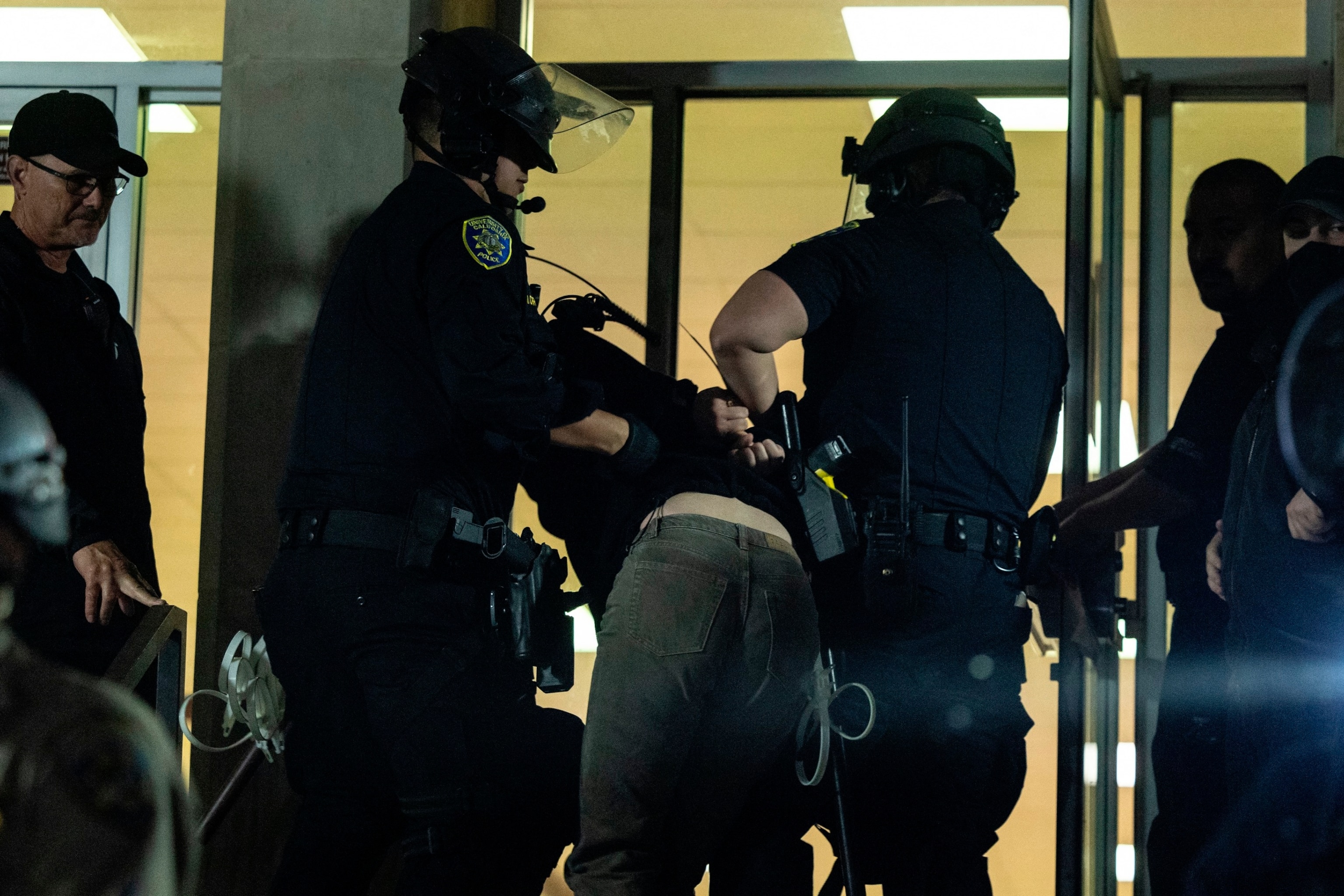 PHOTO: A pro-Palestinian demonstrator is taken into custody as University of California Police and California Highway Patrol officers face pro-Palestinian protesters outside Dodd Hall in the UCLA in Los Angeles, June 10, 2024.