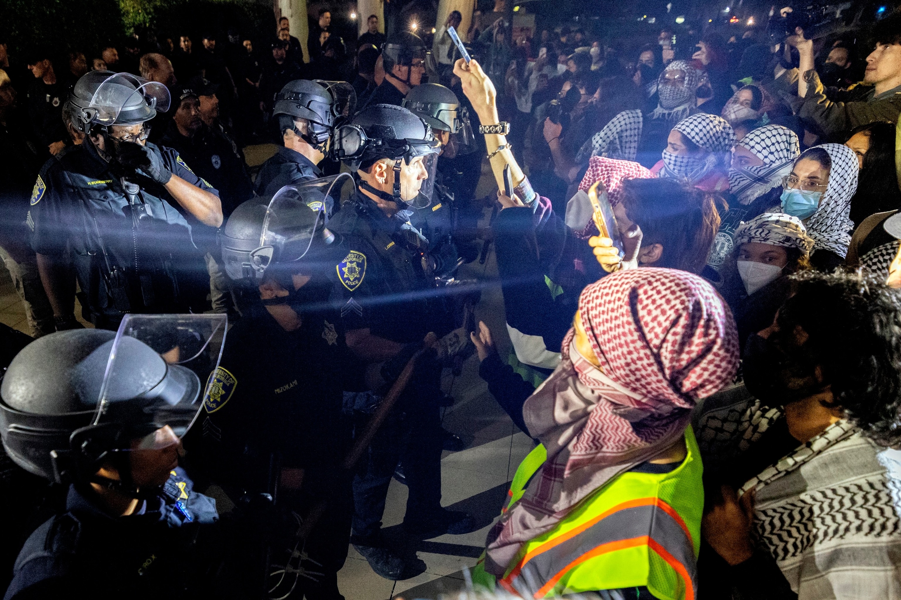 PHOTO: University of California Police officers face pro-Palestinian protesters outside Dodd Hall in the University of California Los Angeles in Los Angeles, June 10, 2024. 