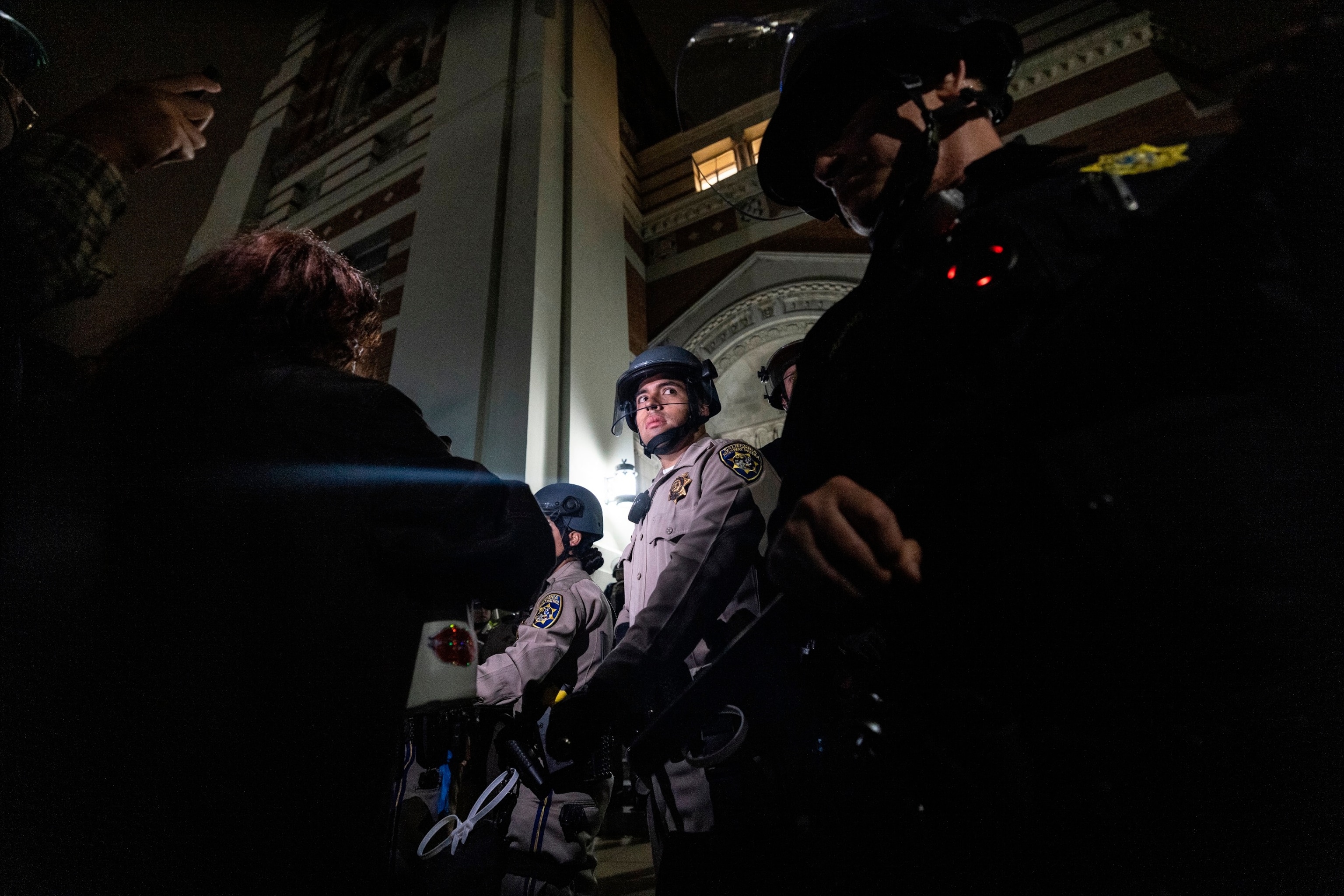 PHOTO: University of California Police and California Highway Patrol officers face pro-Palestinian protesters outside Dodd Hall at UCLA in Los Angeles, June 10, 2024. 