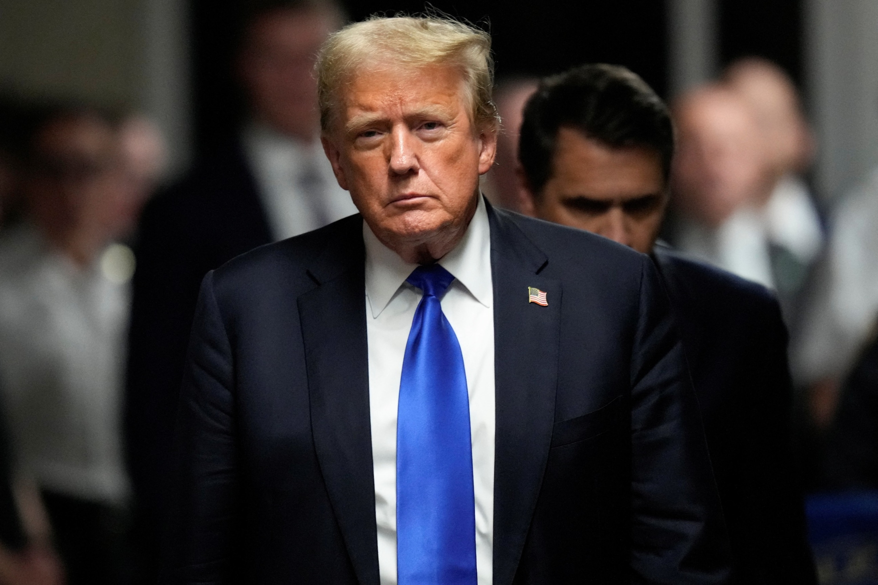 PHOTO: Former President Donald Trump walks to make comments to members of the media after being found guilty on 34 felony counts of falsifying business records in the first degree at Manhattan Criminal Court, May 30, 2024, in New York. 