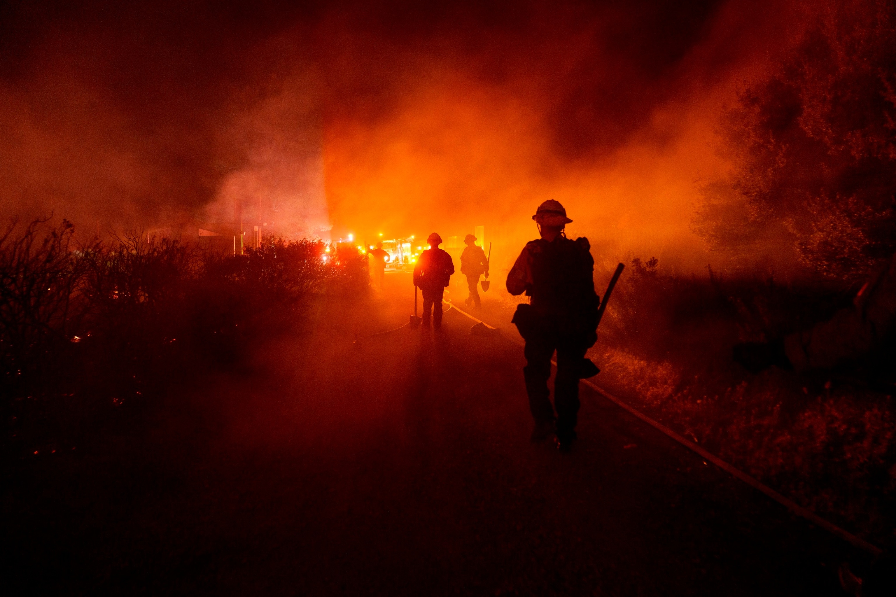 PHOTO: Firefighters work against the advancing Post Fire on June 16, 2024, in Gorman, Calif. 