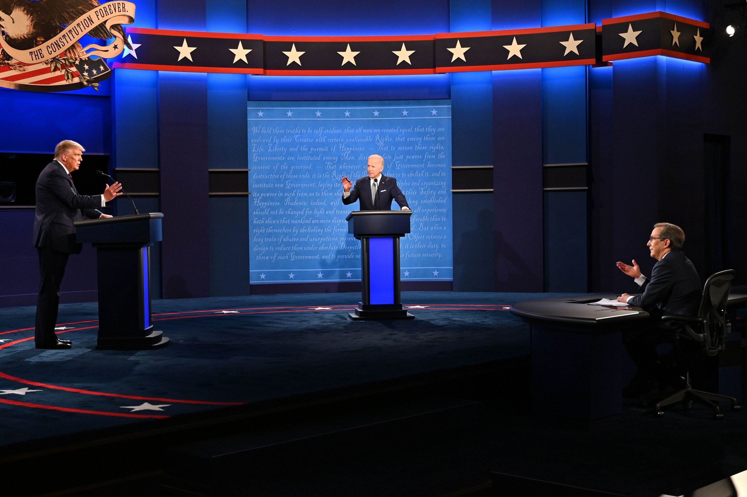 PHOTO: President Donald Trump and former Vice President Joe Biden and moderator and Fox News anchor Chris Wallace speak during the first presidential debate  in Cleveland, OH, Sep. 29, 2020. 