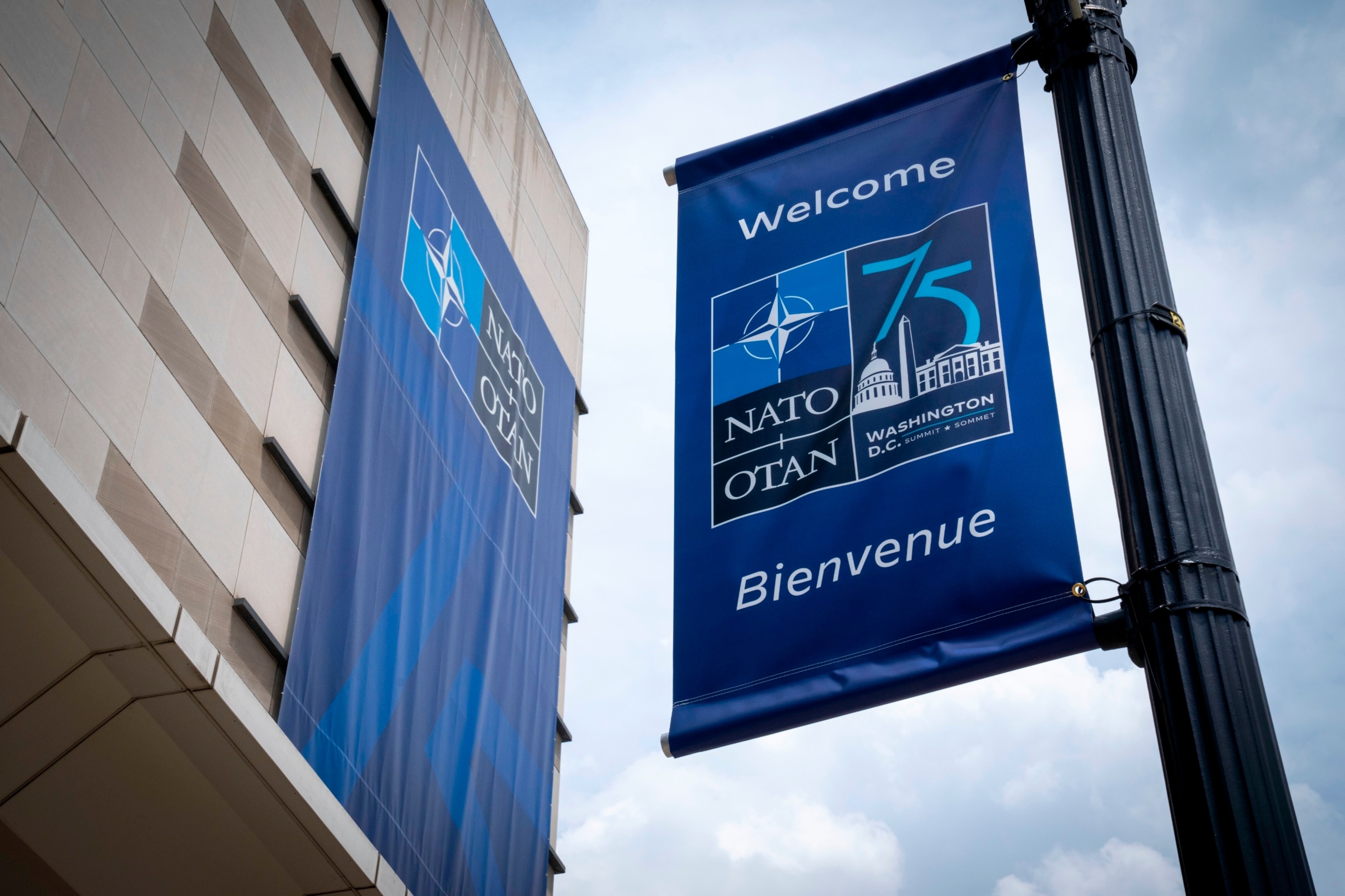 PHOTO: Signage is seen outside the Walter E. Washington Convention Center, which has been draped with signage ahead of the NATO Summit, July 8, 2024. 