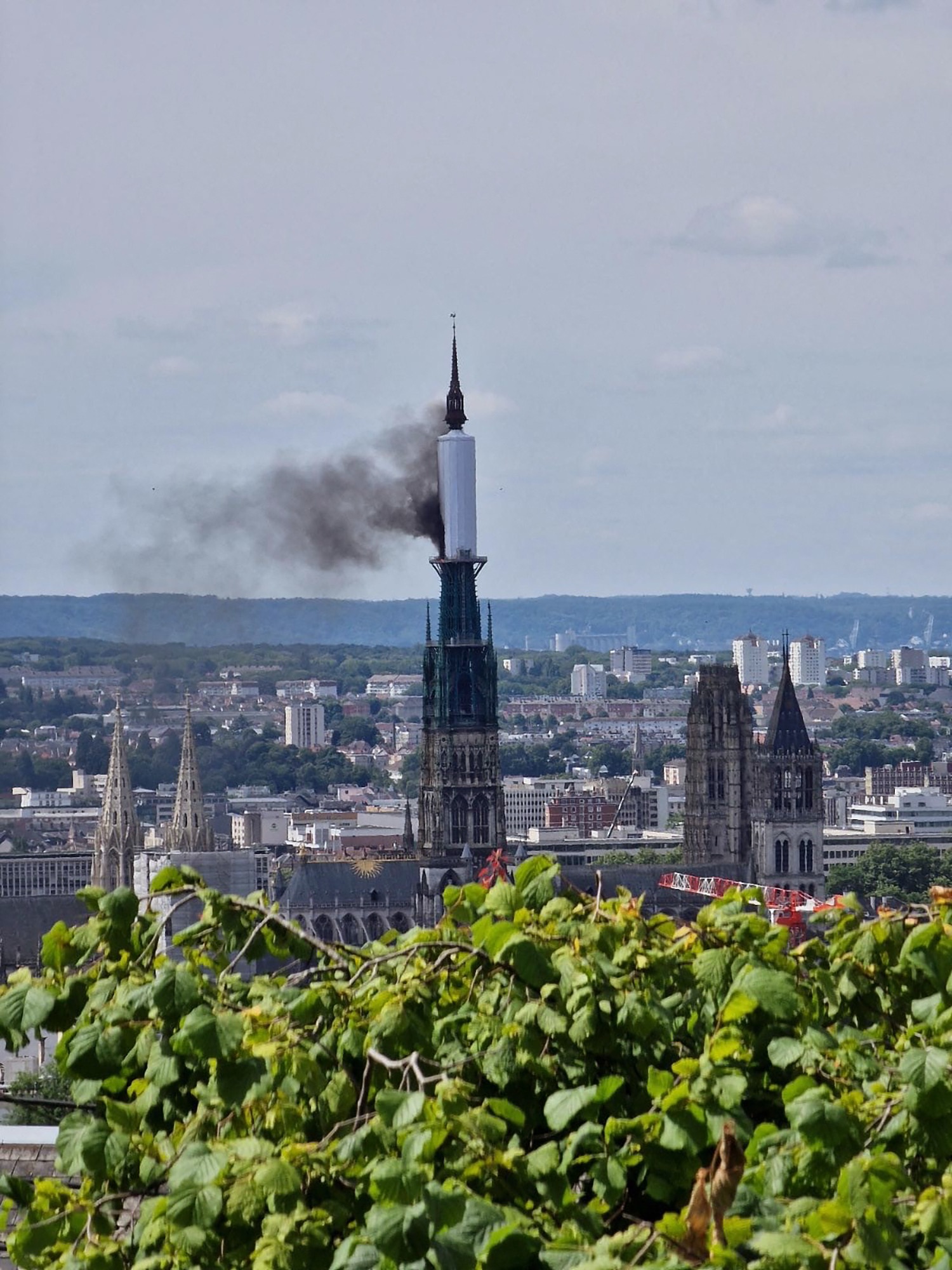 Fire erupts on cathedral spire in Normandy region of France