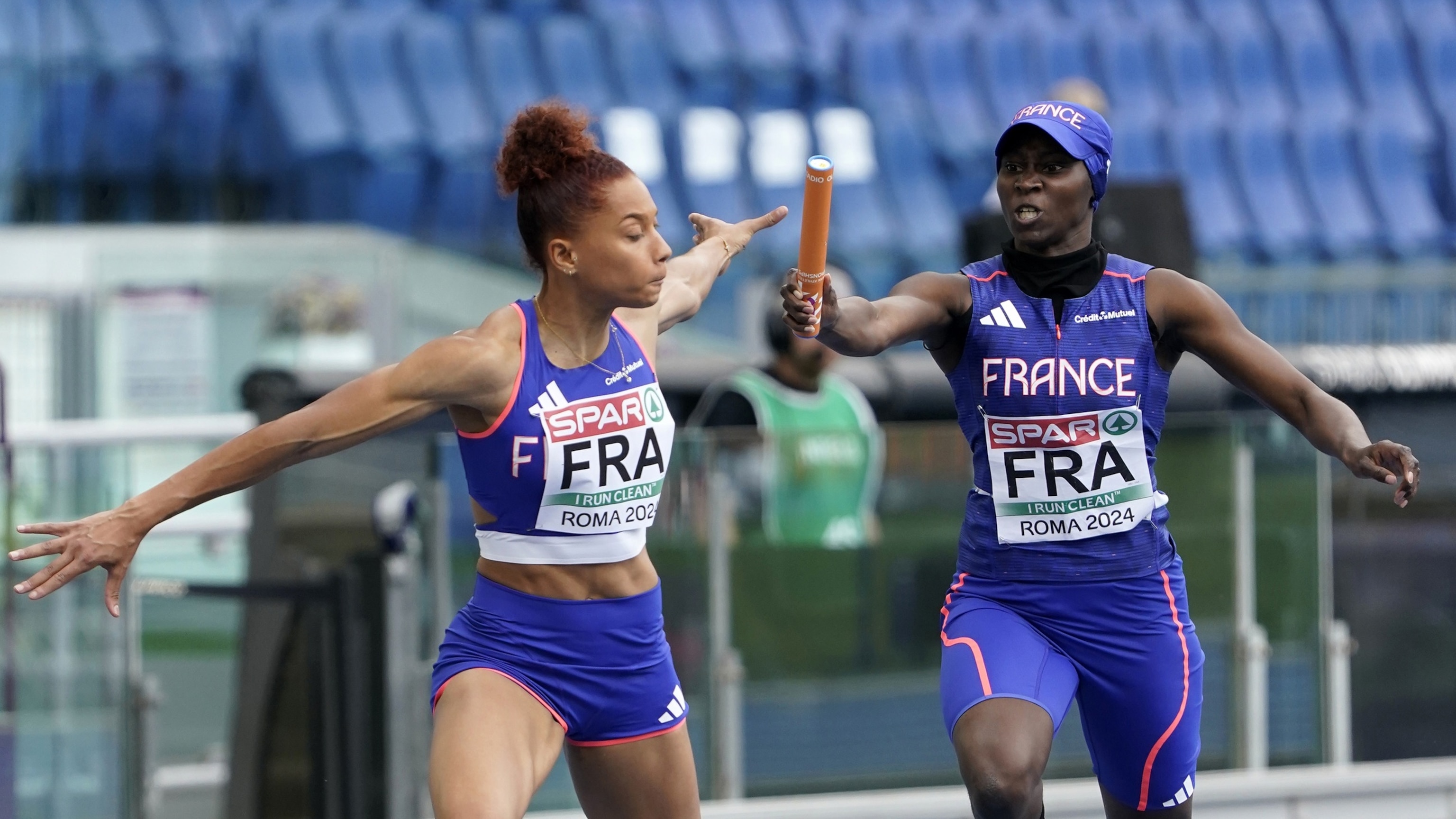 PHOTO: Sylla Sounkamba of team France  handing her baton to Alexe Deau of the team France competing o 4 x 400m Relay Women during day five of the 26th European Athletics Championships - Rome 2024, June 11, 2024, in Rome.