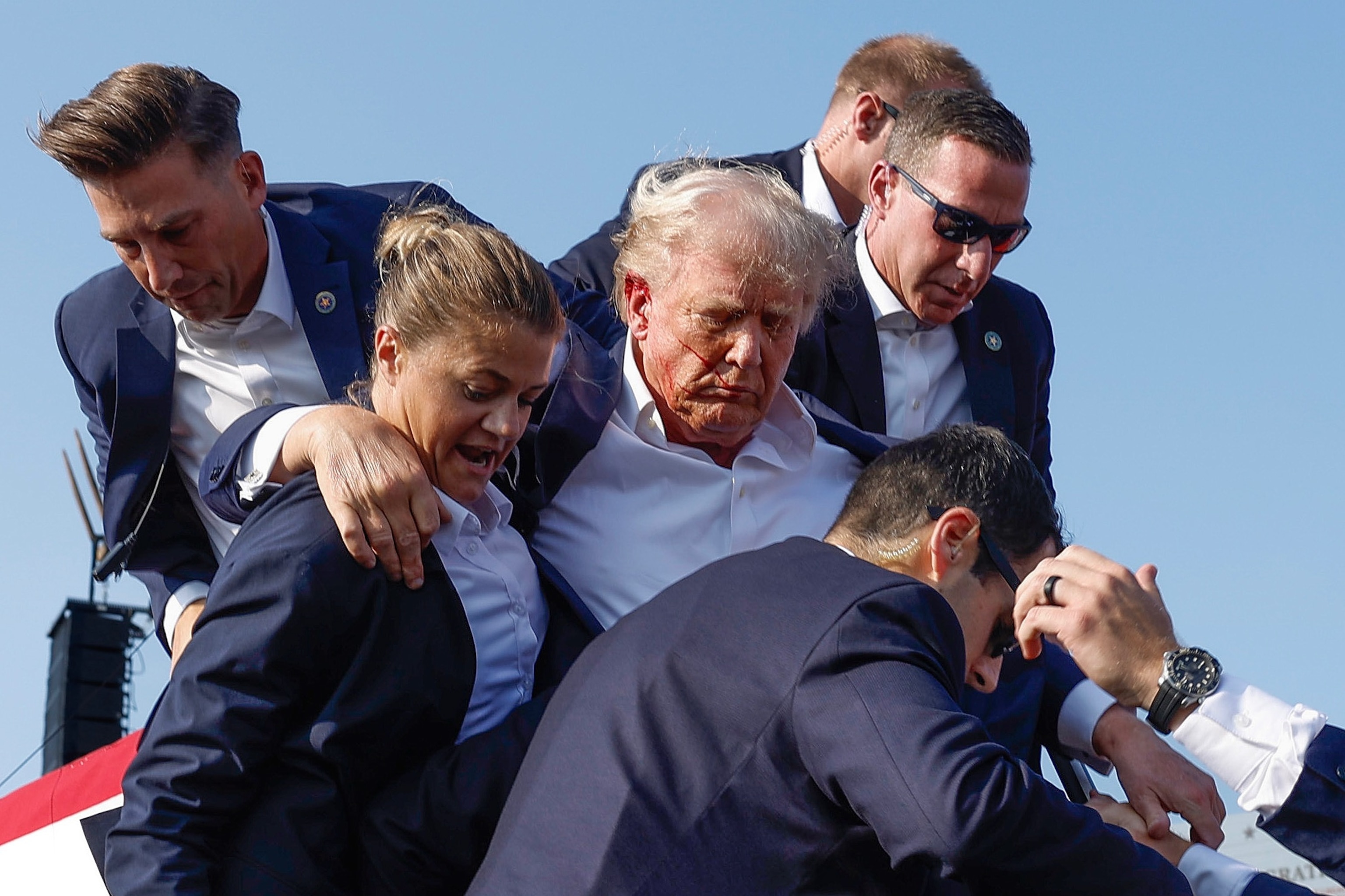 PHOTO: Republican presidential candidate former President Donald Trump is rushed offstage by U.S. Secret Service agents after being grazed by a bullet during a rally on July 13, 2024 in Butler, Pennsylvania.