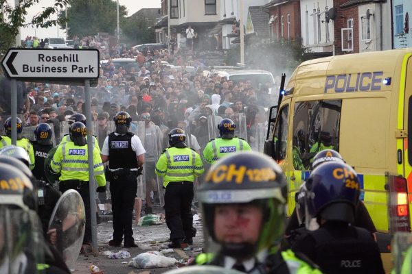 Police respond to violent protest in UK following vigil for stabbing spree