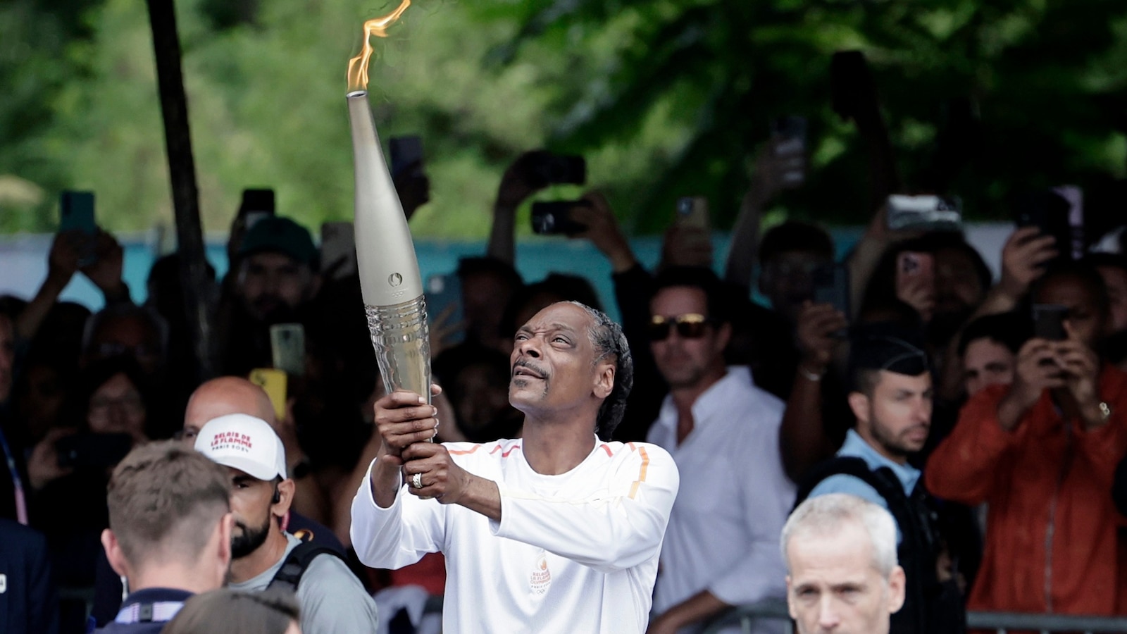 Snoop Dogg participates in Olympic torch relay ahead of Paris opening ceremony