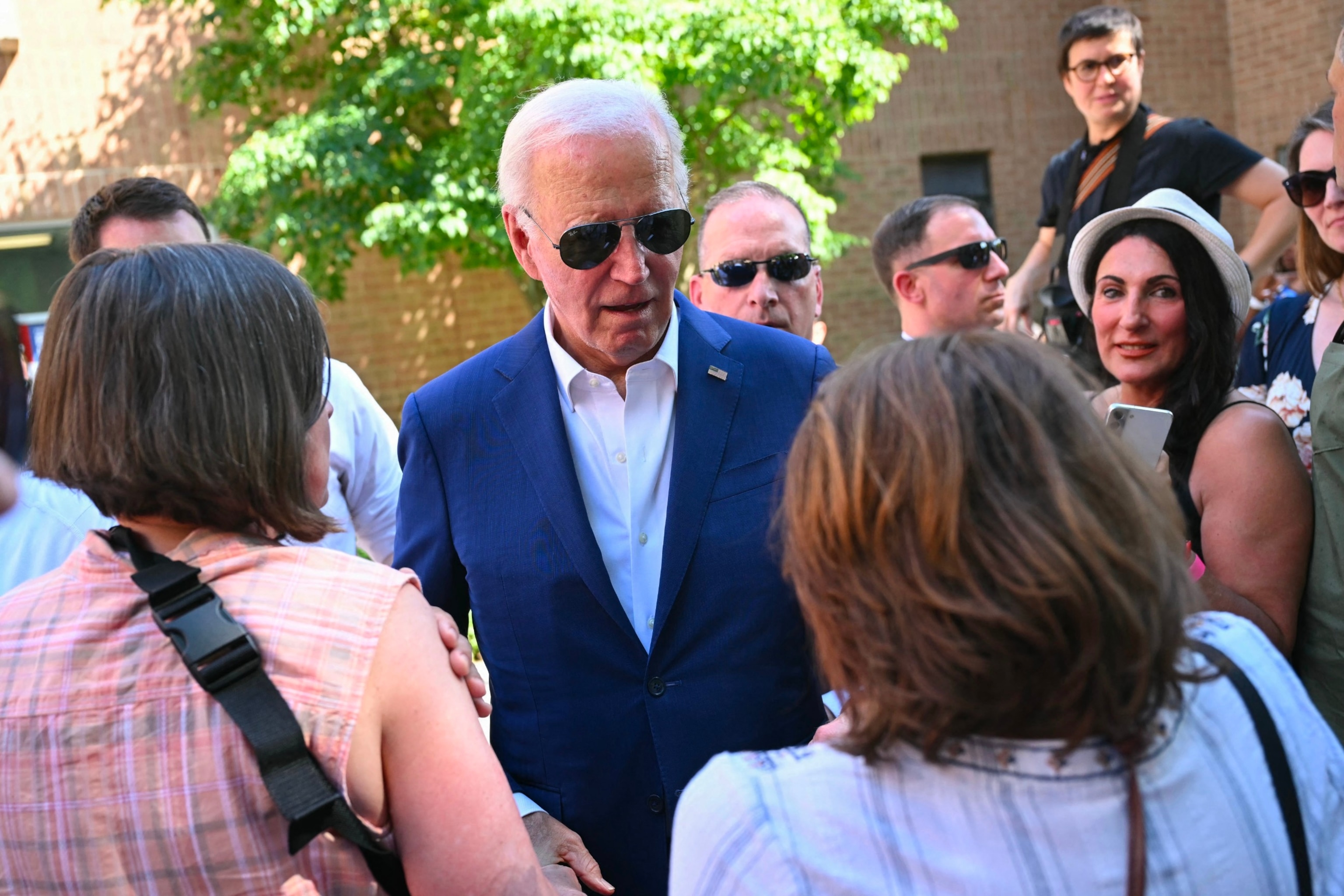 U.S. President Joe Biden greets supporters and volunteers during a campaign stop at a Biden-Harris campaign office in Harrisburg, Pennsylvania, on July 7, 2024. (Photo by SAUL LOEB / AFP)