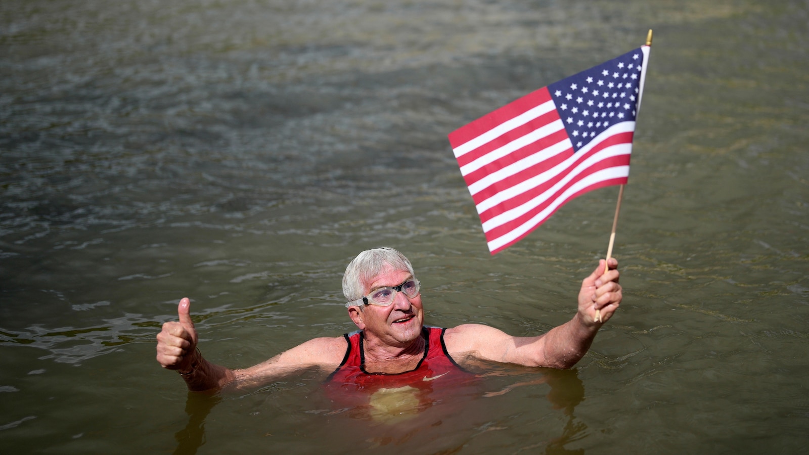Swimmer from the United States takes a dip in the Seine River ahead of Olympics despite pollution worries