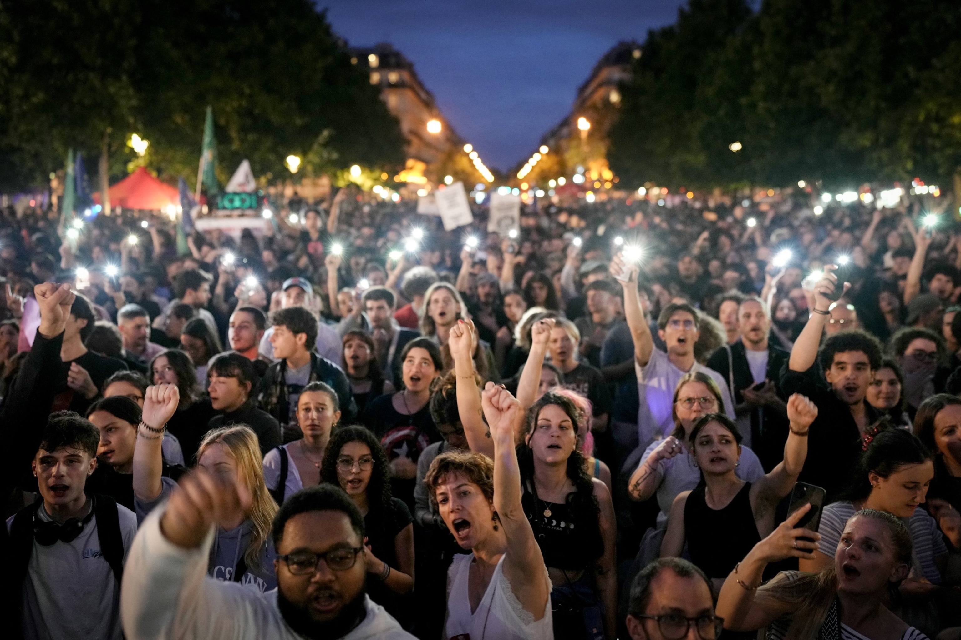 PHOTO: Demonstrators react as they take part in a rally after the announcement of the results of the first round of French parliamentary elections, at Place de la Republique in Paris on June 30, 2024.