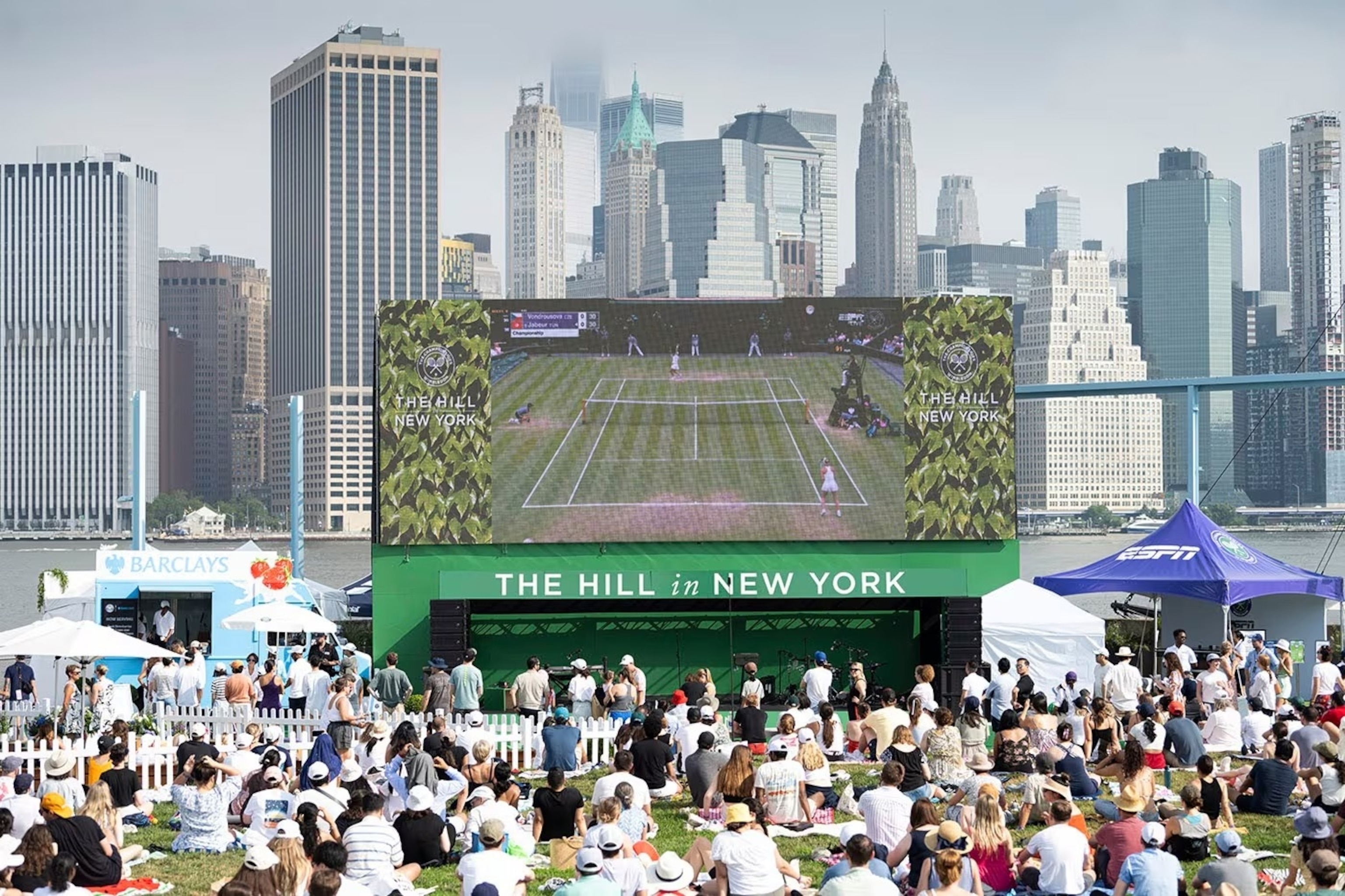 PHOTO:  Fans gather across the pond in Brooklyn Bridge Park to experience a taste of Wimbledon at The Hill in New York.