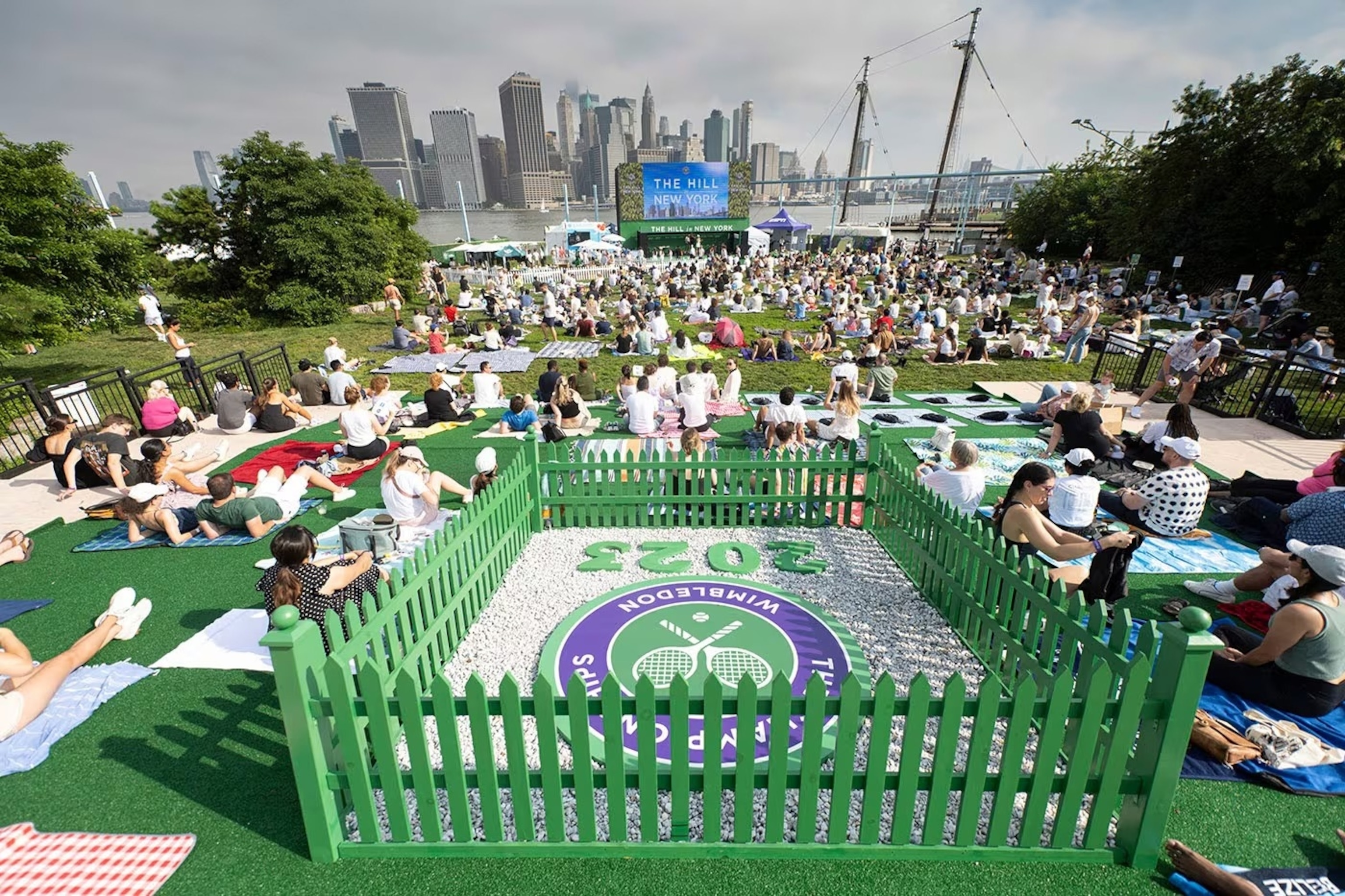 PHOTO:  Fans gather across the pond in Brooklyn Bridge Park to experience a taste of Wimbledon at The Hill in New York.