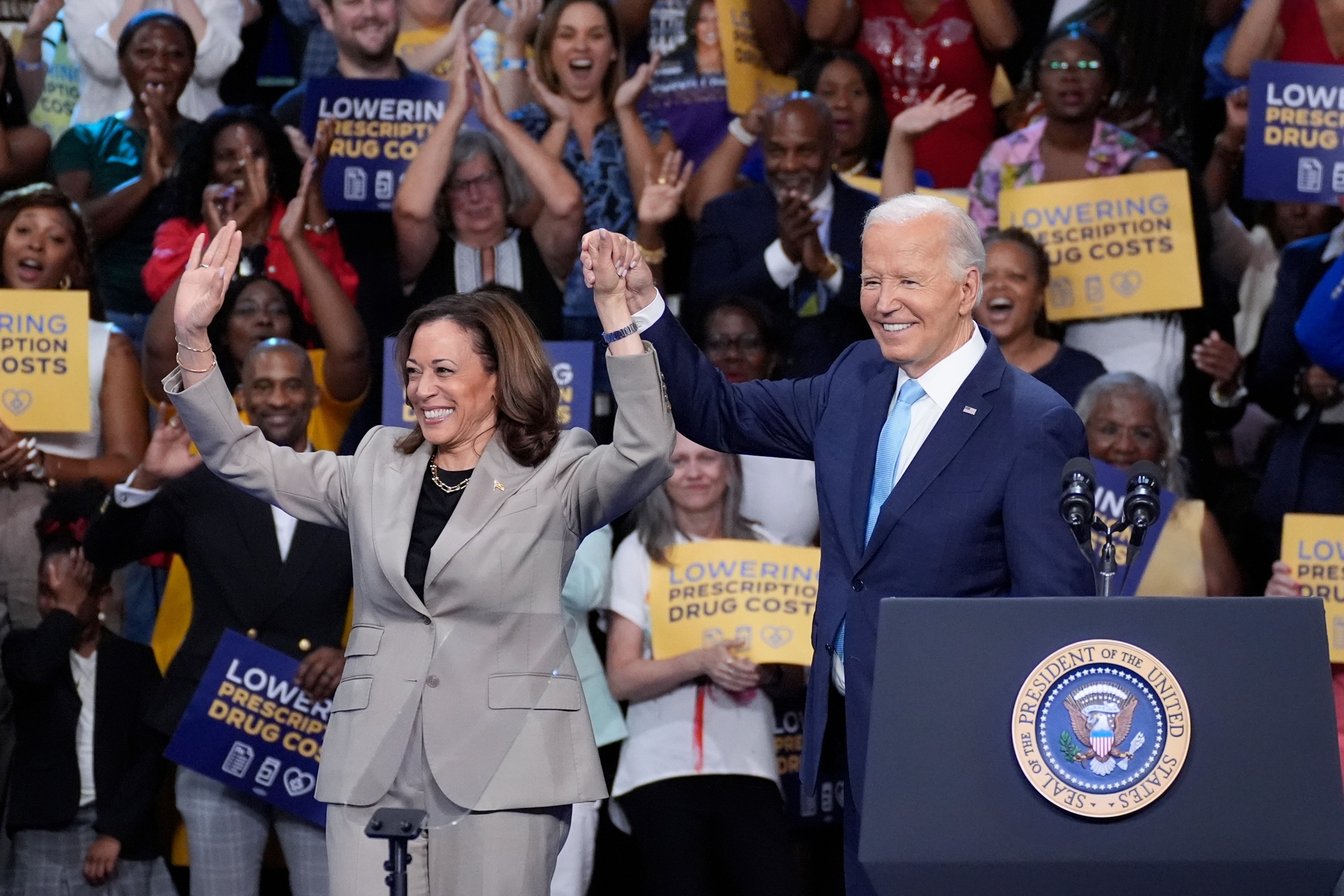 PHOTO: President Joe Biden and Vice President Kamala Harris finish speaking about their administration's efforts to lower prescription drug costs during an event at Prince George's Community College in Largo, Md., Aug. 15, 2024