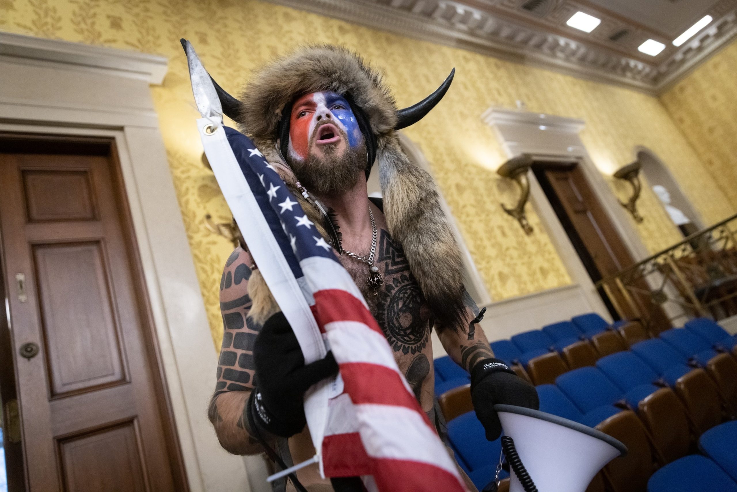 Judge rules that Justice Department must return helmet and spear to 'QAnon Shaman'