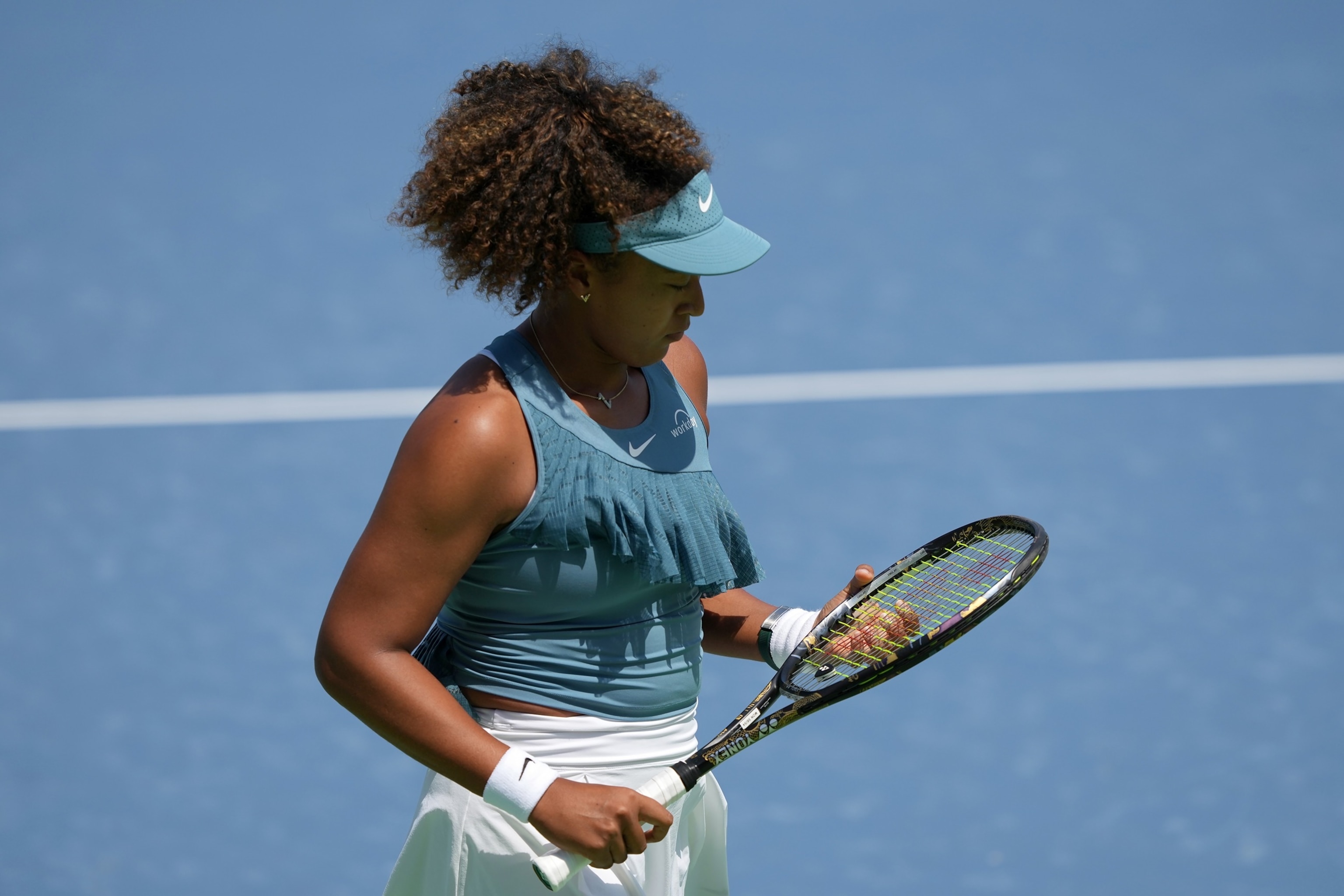 PHOTO: Naomi Osaka of Japan walks across the court  during her match against Ashlyn Krueger of the United States (not pictured) during Day 2 of the Cincinnati Open at the Lindner Family Tennis Center on Aug. 12, 2024 in Mason, Ohio. 