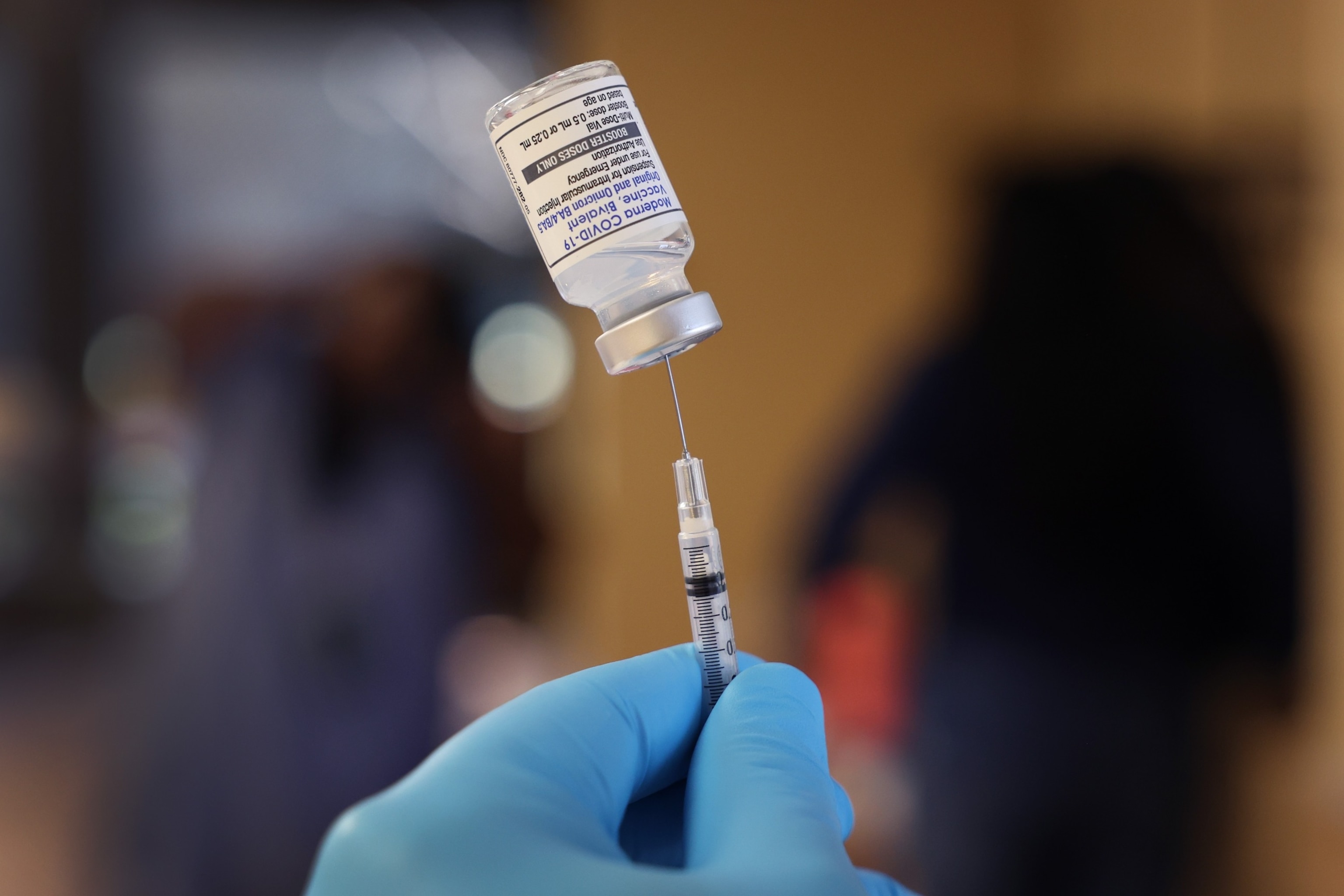 PHOTO:  A pharmacist prepares to administer  COVID-19 vaccine booster shots during an event hosted by the Chicago Department of Public Health at the Southwest Senior Center on Sept. 9, 2022 in Chicago.