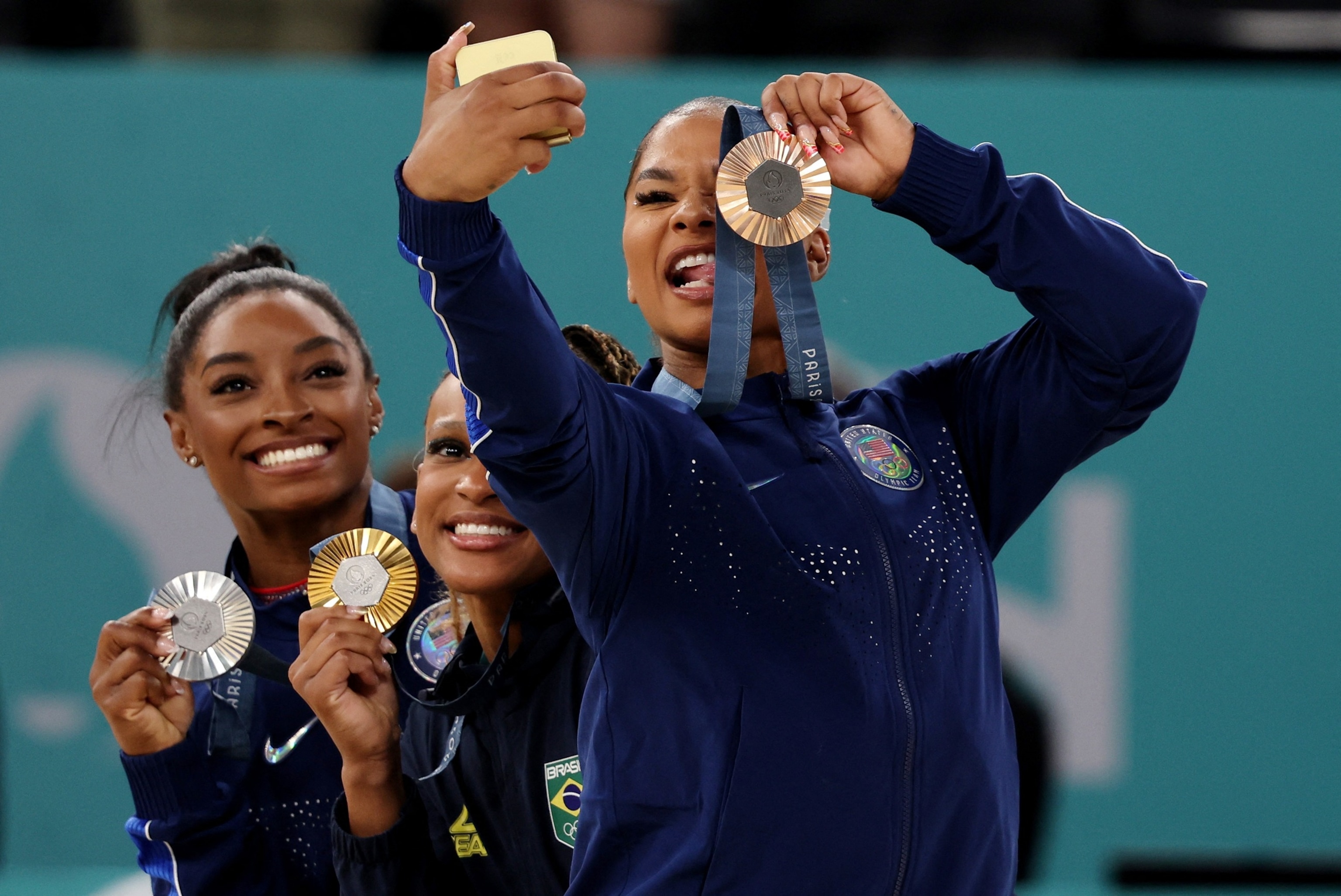 PHOTO: Gold medalist Rebeca Andrade of Brazil stands with silver medalist Simone Biles of the U.S and bronze medalist Jordan Chiles of the U.S. following the women's artistic gymnastics floor exercise final at the 2024 Paris Olympics, Aug. 5, 2024.