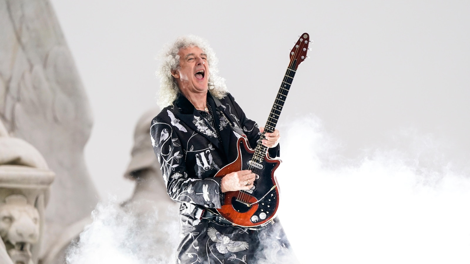 Brian May, Queen guitarist, reveals he experienced a minor stroke but remains able to play music