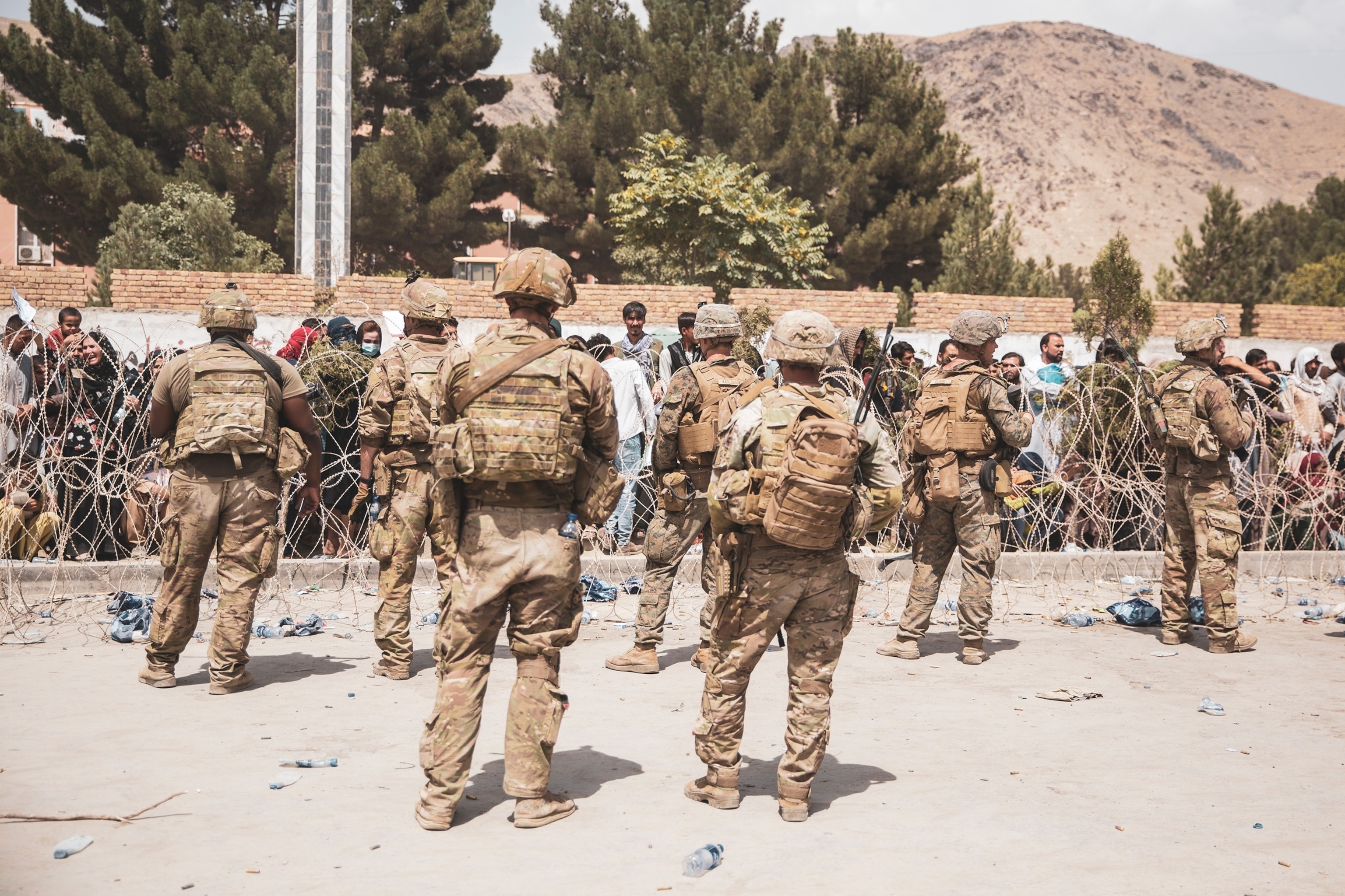 PHOTO: This handout image shows  U.S. Soldiers and Marines assist with security at an Evacuation Control Checkpoint during an evacuation at Hamid Karzai International Airport in Kabul, Afghanistan, Aug.  19, 2021. 