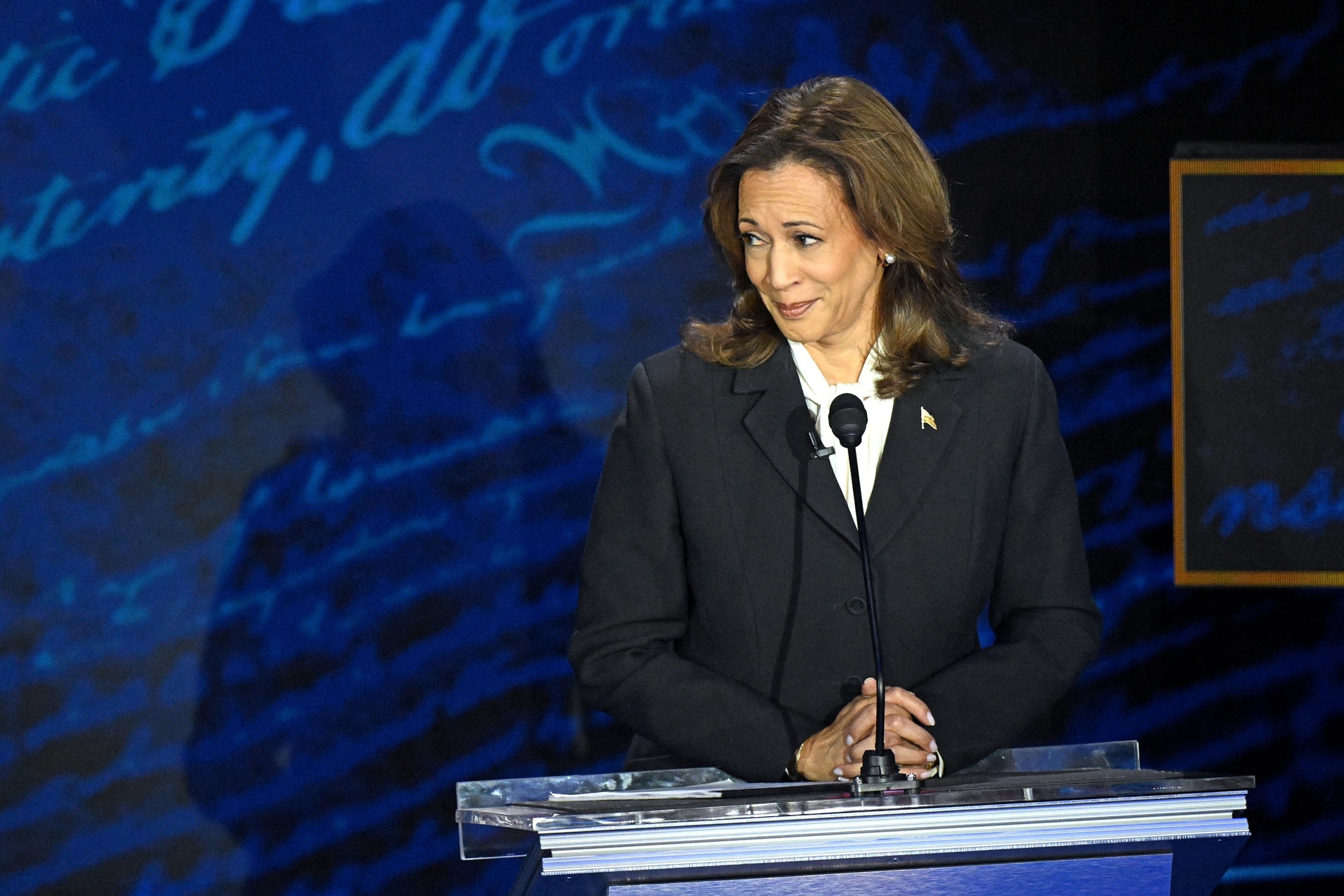 PHOTO: Vice President and Democratic presidential candidate Kamala Harris listens as former President and Republican presidential candidate Donald Trump speaks during a presidential debate in Philadelphia, on Sept. 10, 2024. 