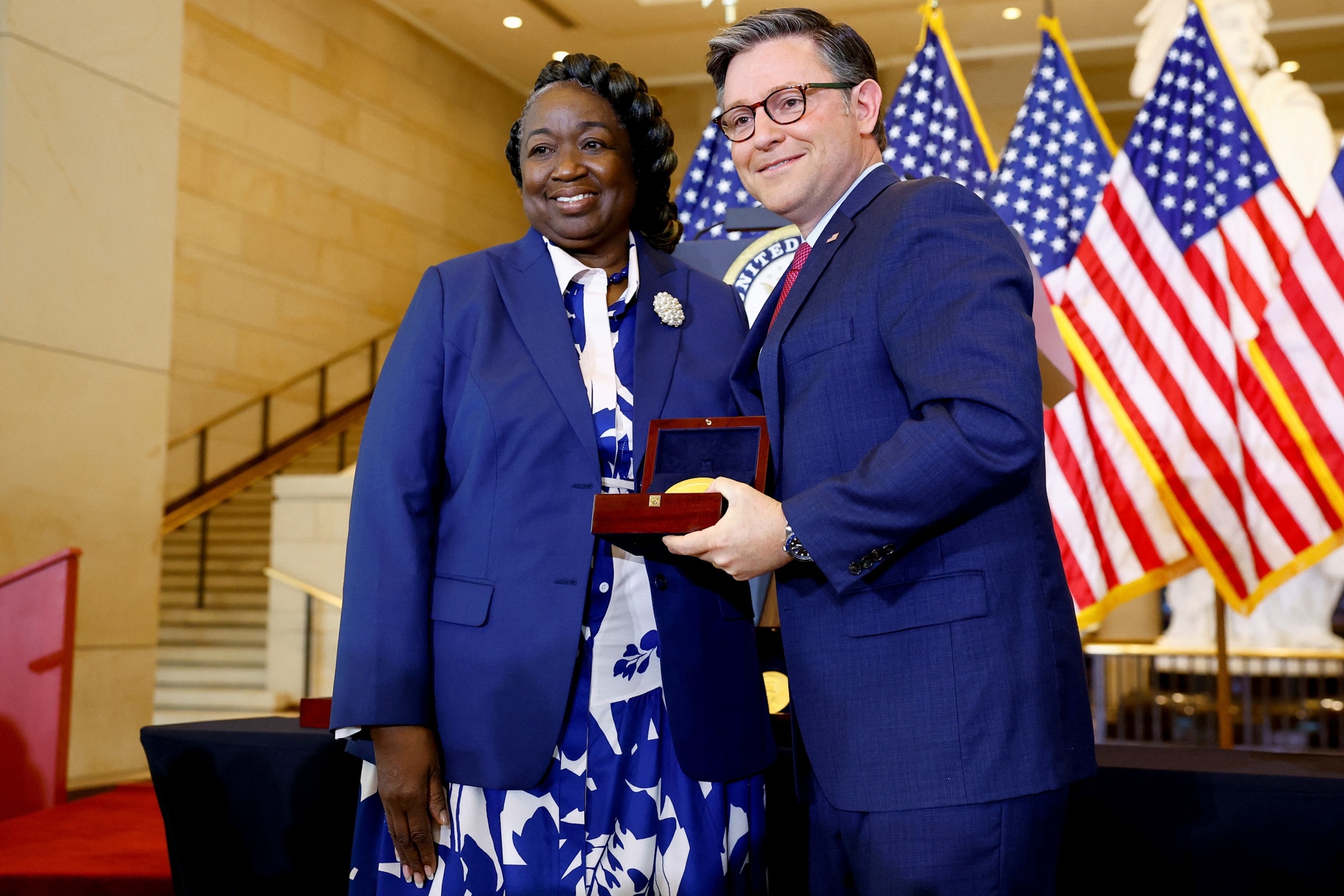 PHOTO: House Speaker Mike Johnson presents a Congressional Gold Medal to Andrea Mosie, Apollo Sample Lead Processor, during a Congressional Gold Medal ceremony to honor women who served at NASA, Washington, DC, Sept. 18, 2024.