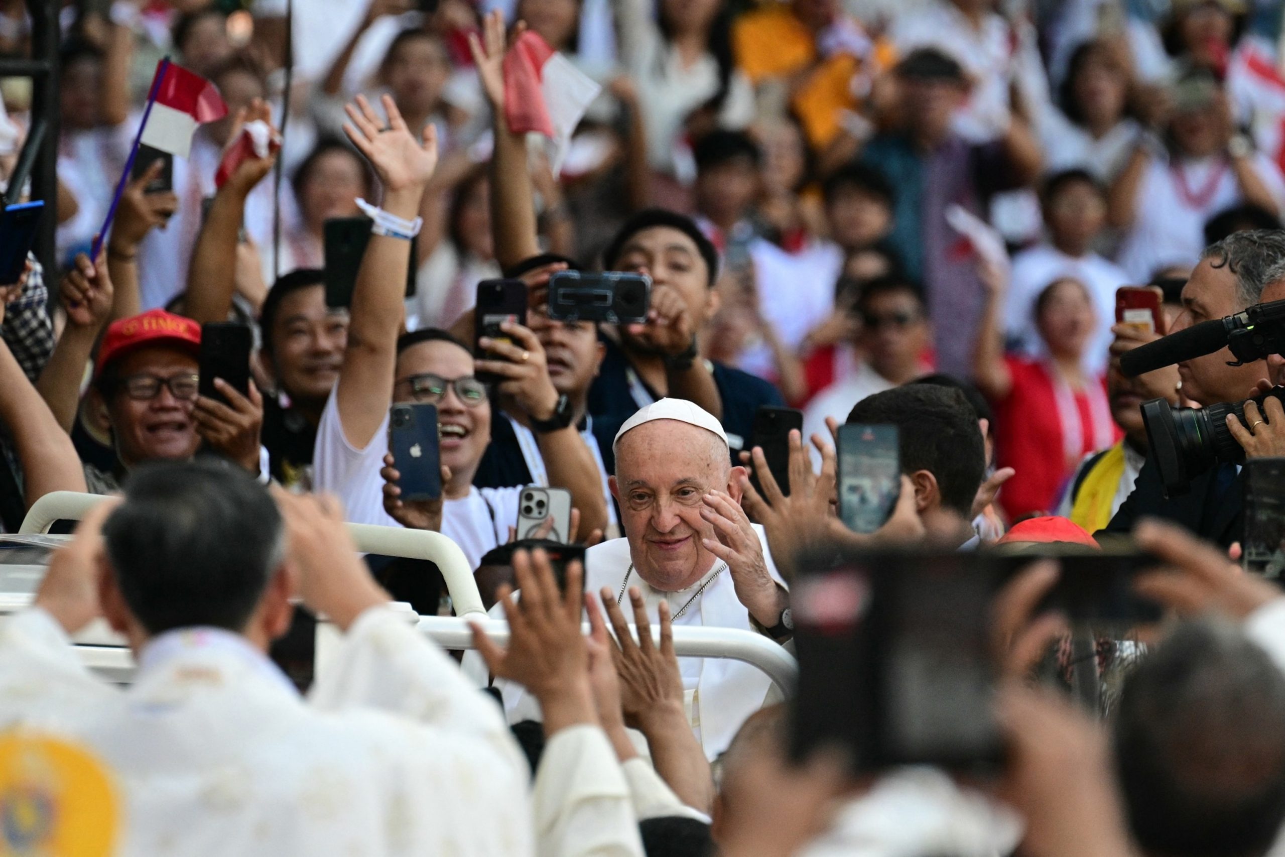 Pope Francis advocates for religious harmony in Indonesia and denounces violent extremism-driven conflicts.