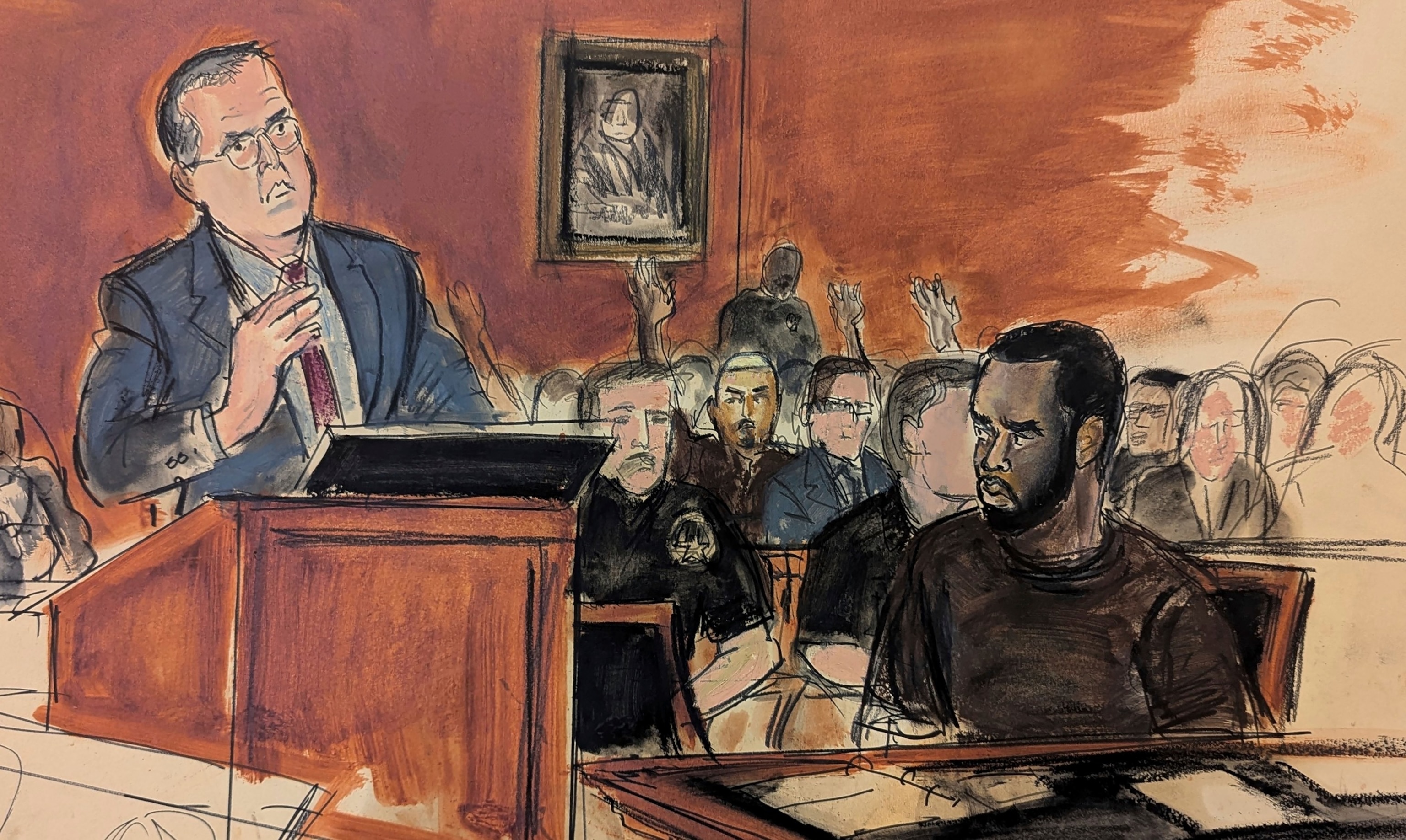 In this courtroom sketch, Sean Combs, seated right, looks at his attorney, Marc Agnifilo, left, as he delivers his bail argument on Tuesday, Sept. 17, 2024, in Manhattan Federal Court in New York. (Elizabeth Williams via AP)