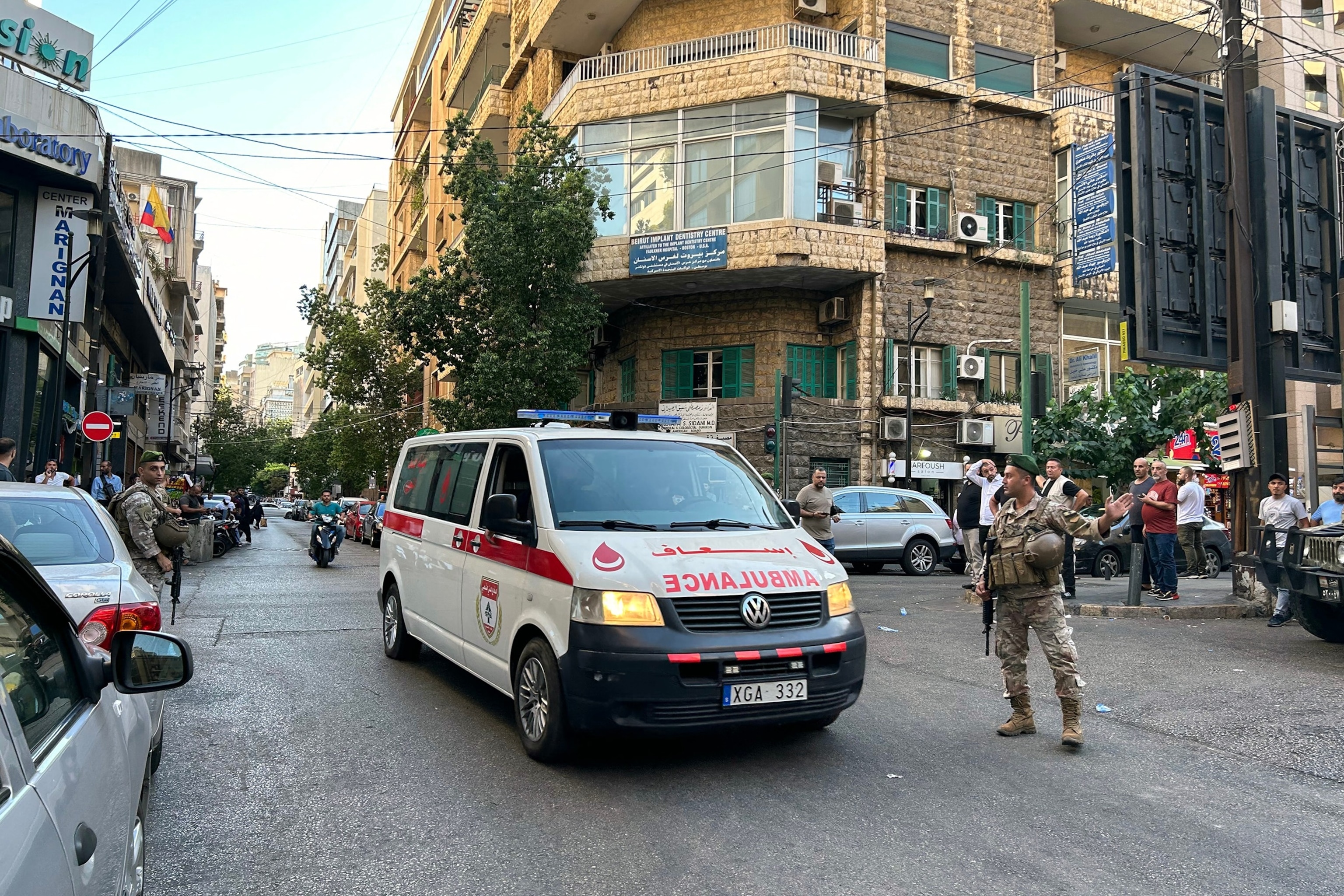 An ambulance rushes wounded people to a hospital in Beirut on September 17, 2024, after explosions hit locations in several Hezbollah strongholds around Lebanon. (Photo by Anwar AMRO / AFP) (Photo by ANWAR AMRO/AFP via Getty Images)